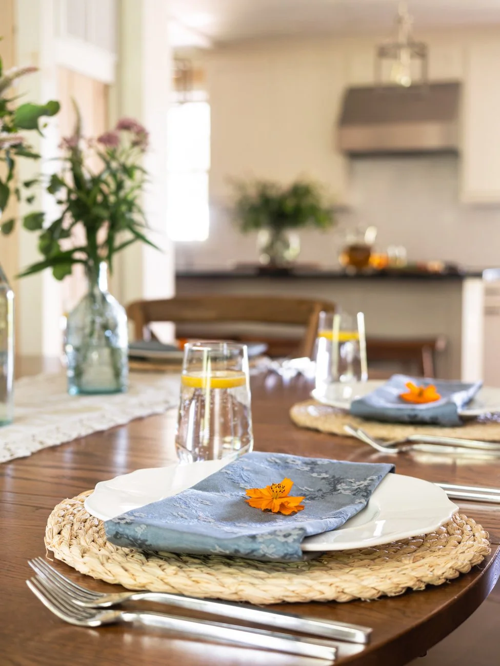 Table setting in a house with kitchen in background