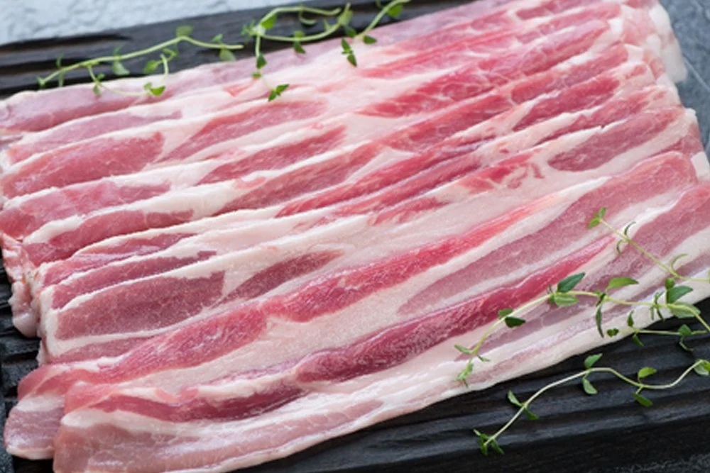 a close up shot of forest-fed pork bacon