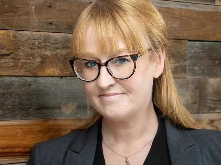 Emily with wood backdrop