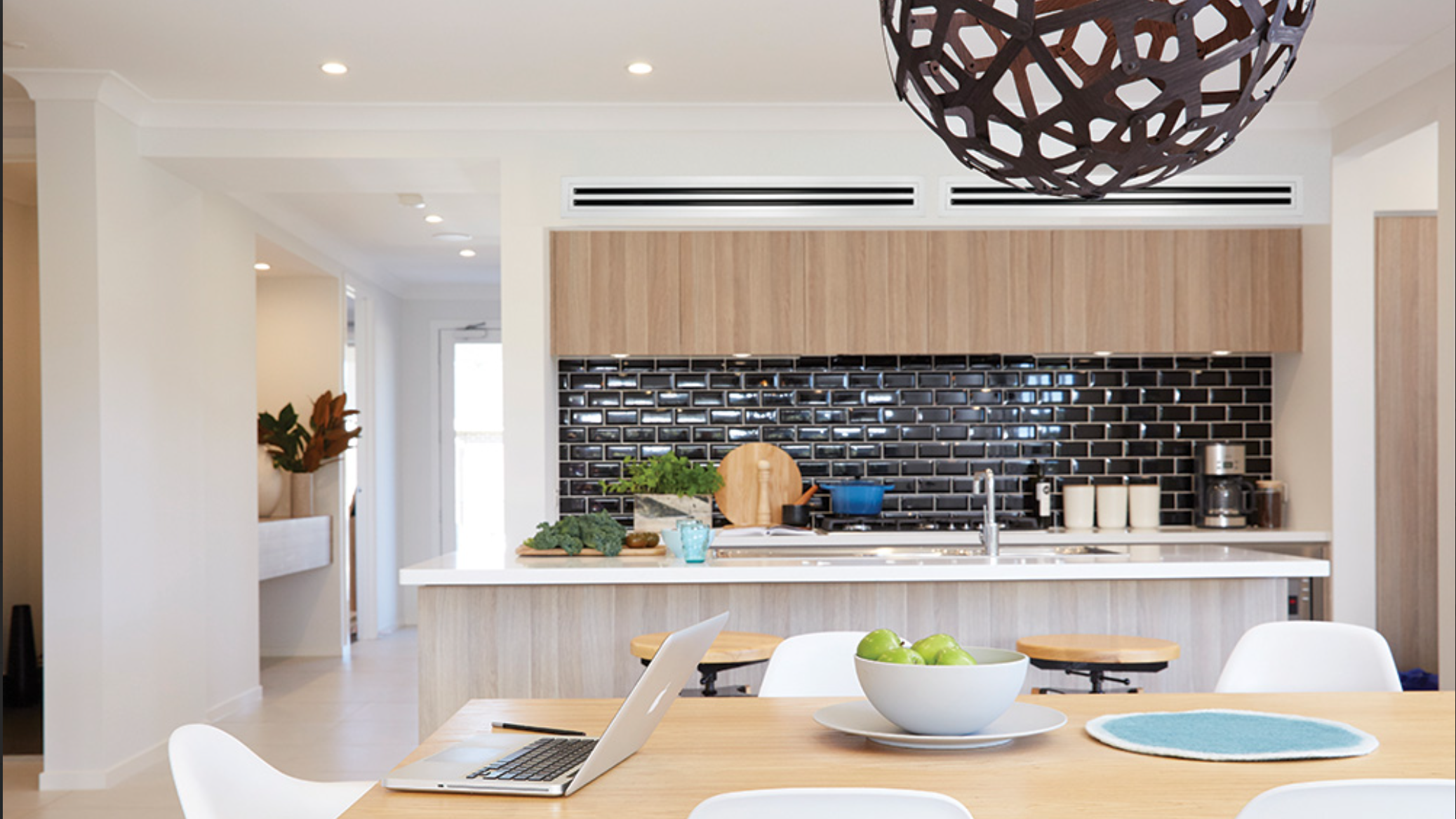 Modern kitchen with ducted heat pump grilles
