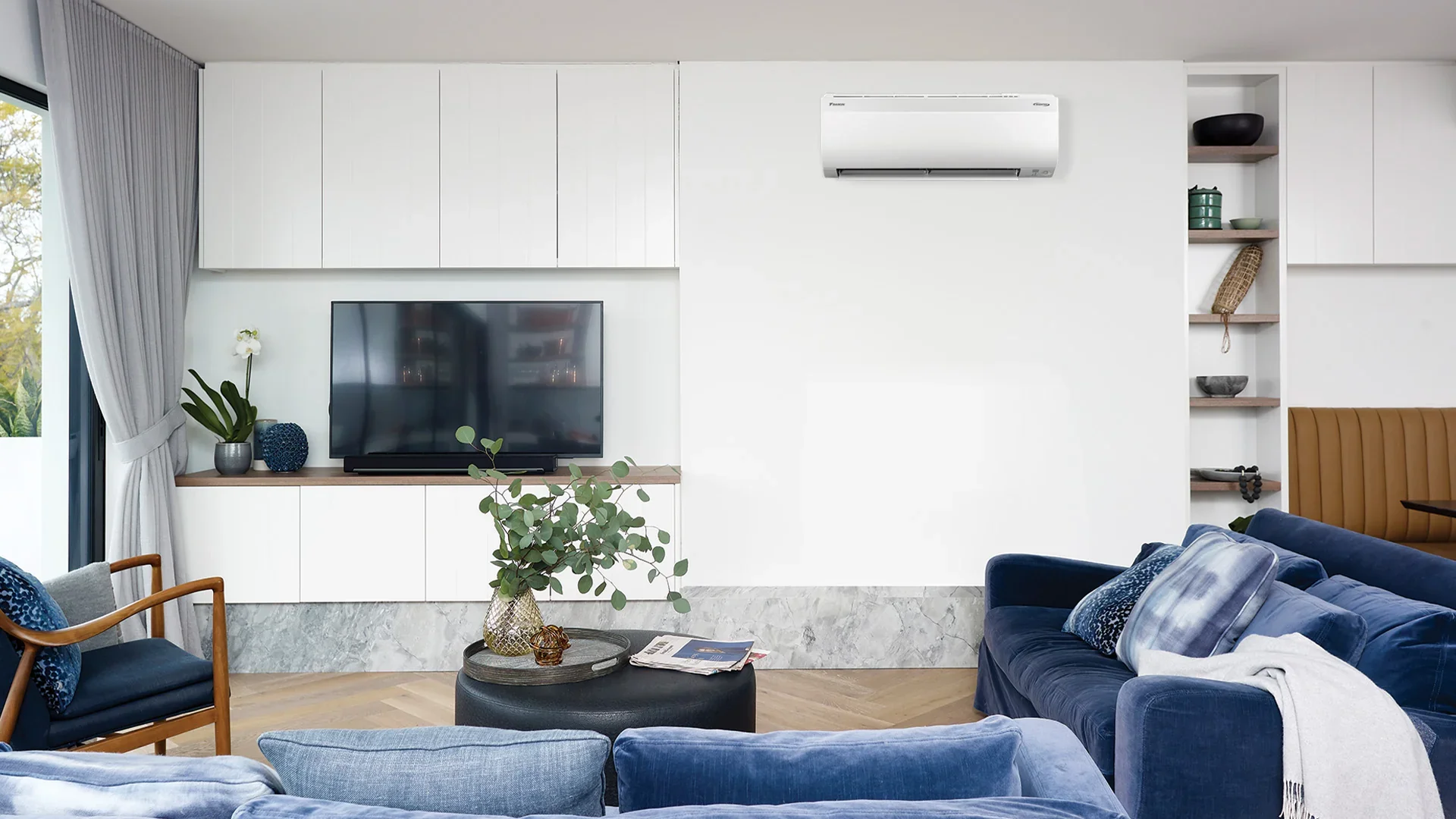 Daikin high wall heat pump unit on lounge wall
