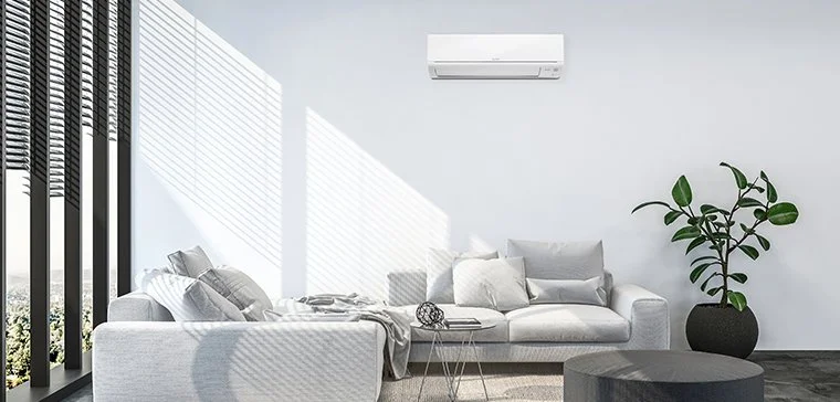 Mitsubishi high wall heat pump unit on lounge wall