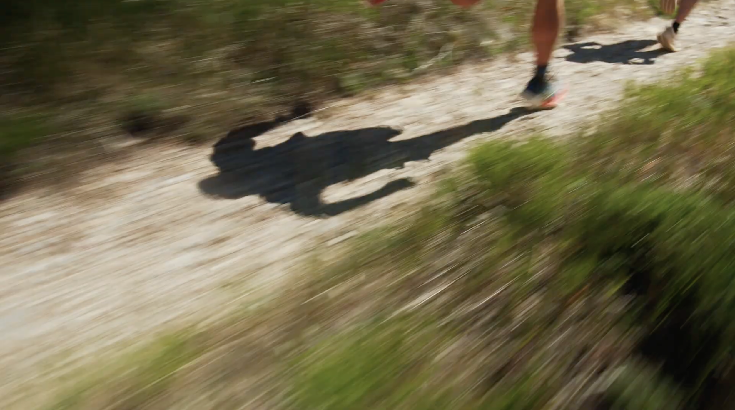 Taylor Stack trail running with blurry feet in Colorado