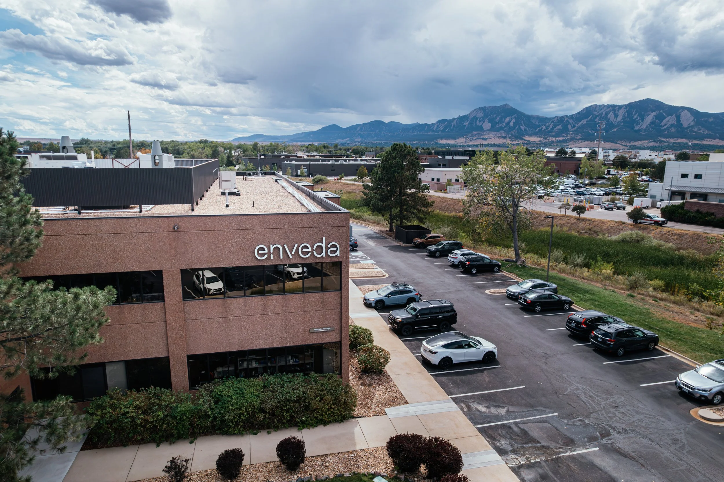 Enveda’s Colorado building with the foothills beyond it