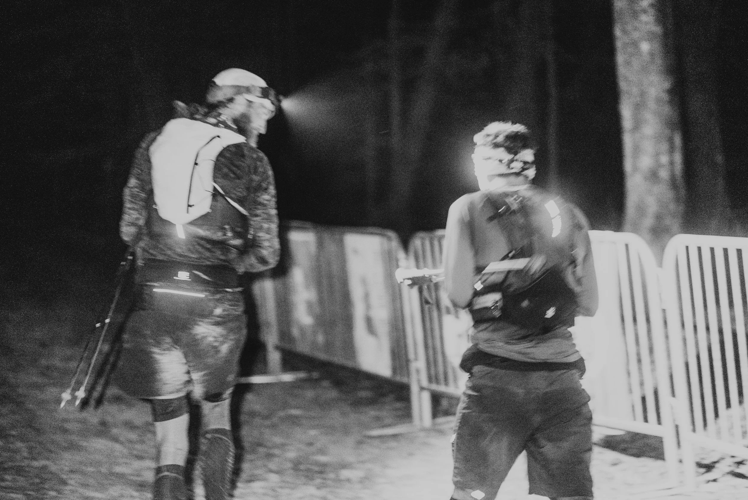two runners in the dark running by headlamp