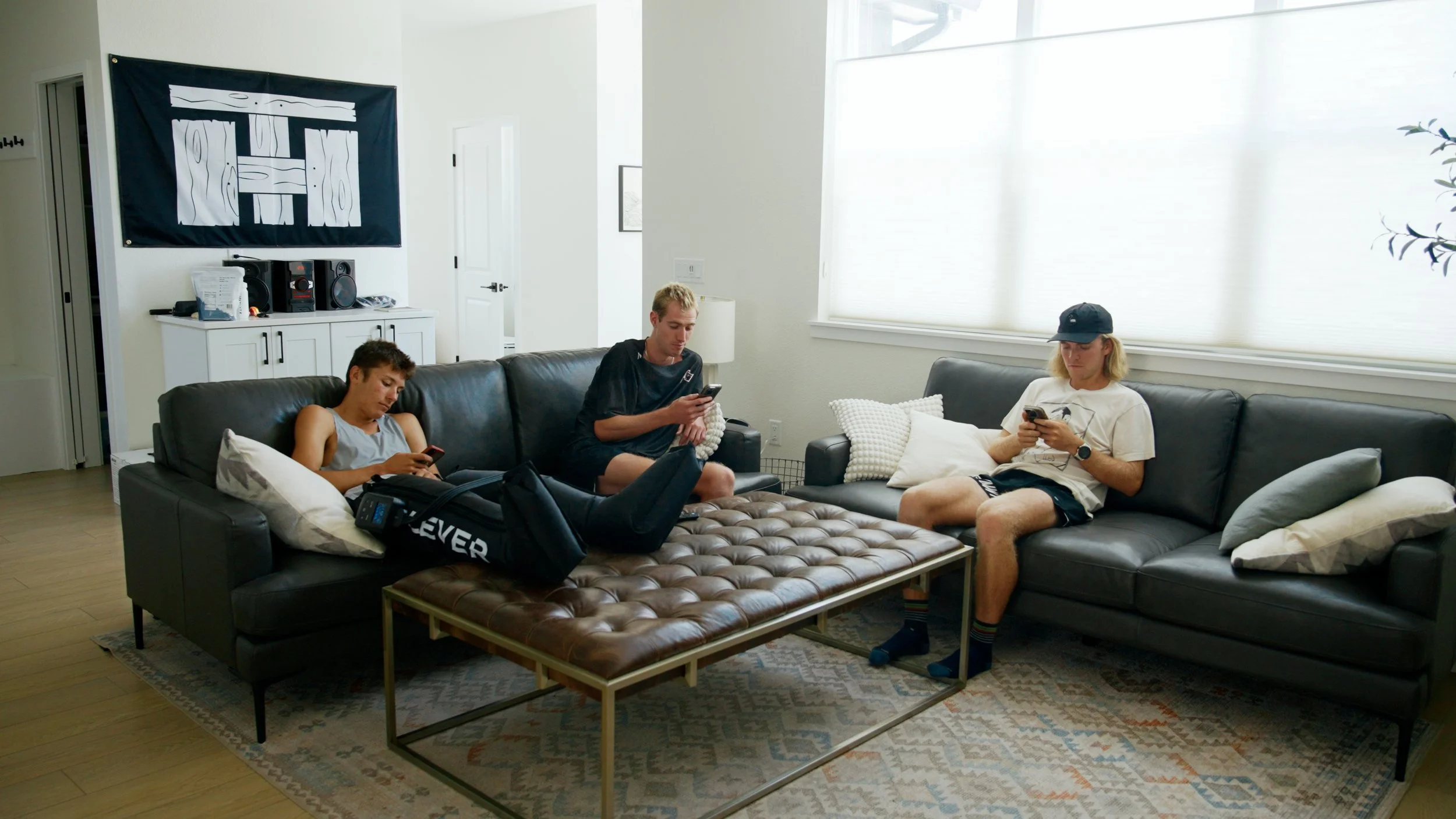 Trail House athletes discussing ultrarunning training in their Boulder home