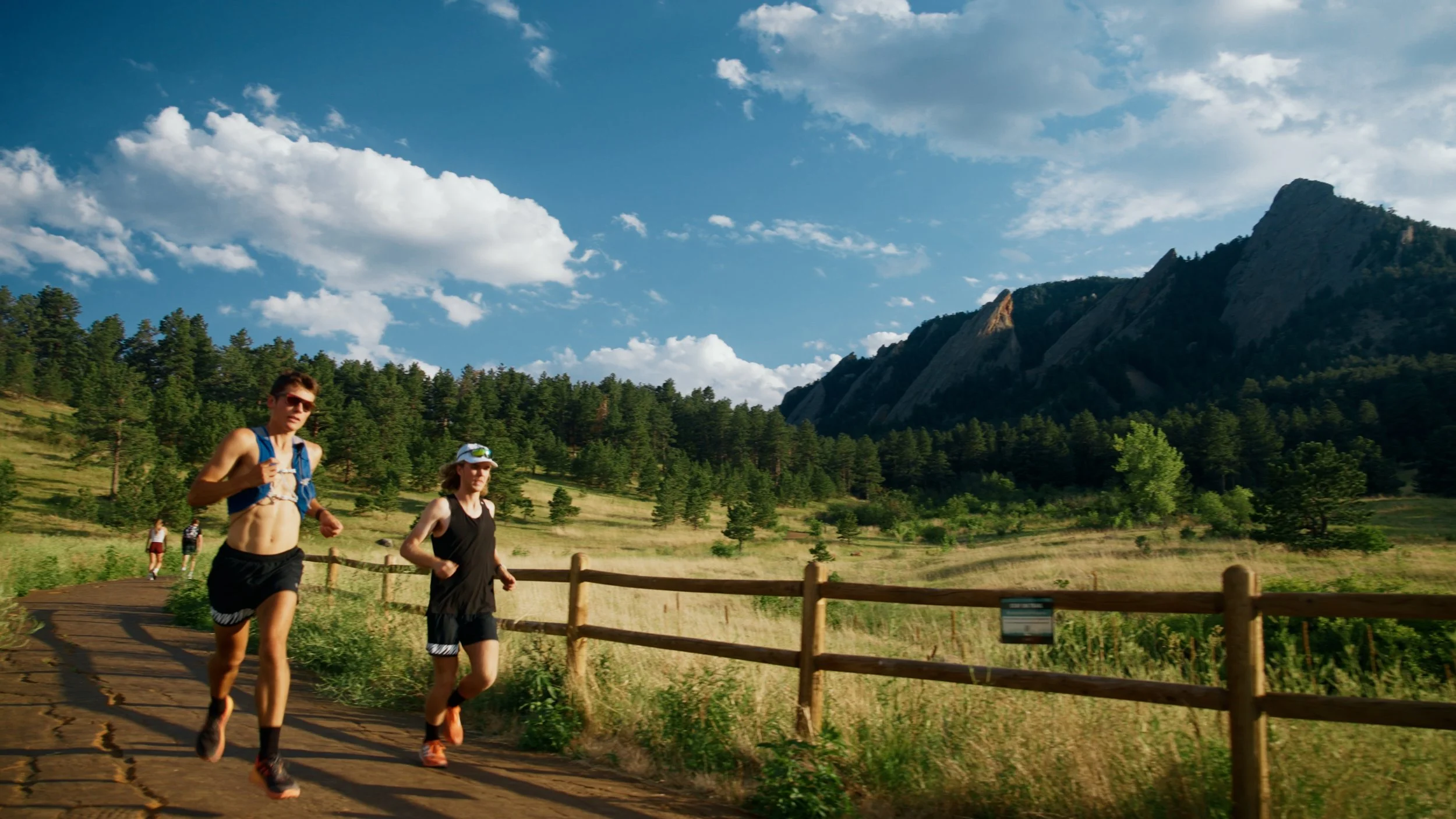 Dylan and Bayden running at Chautauqua Park near the Second Flatiron during The Trail House Episode 2