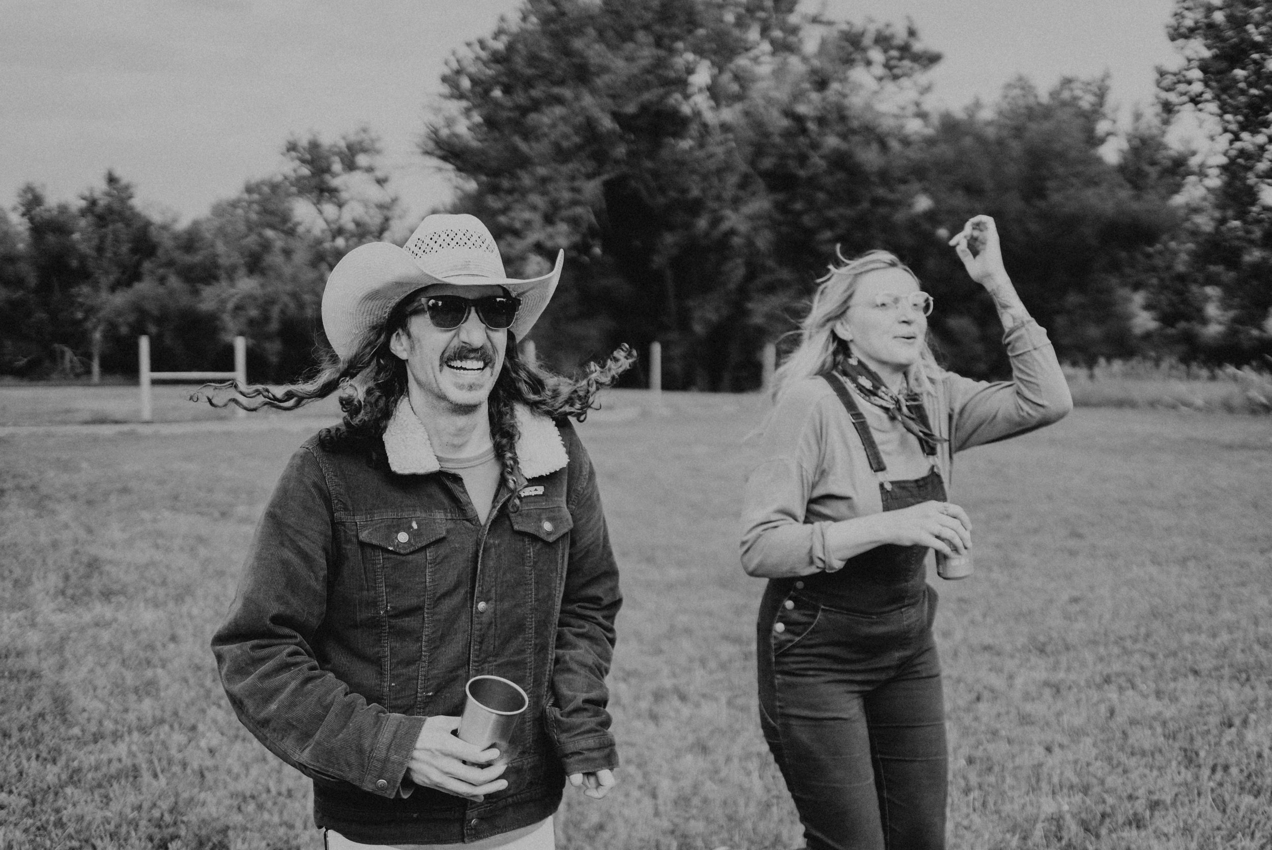 two people running with a cup in hand