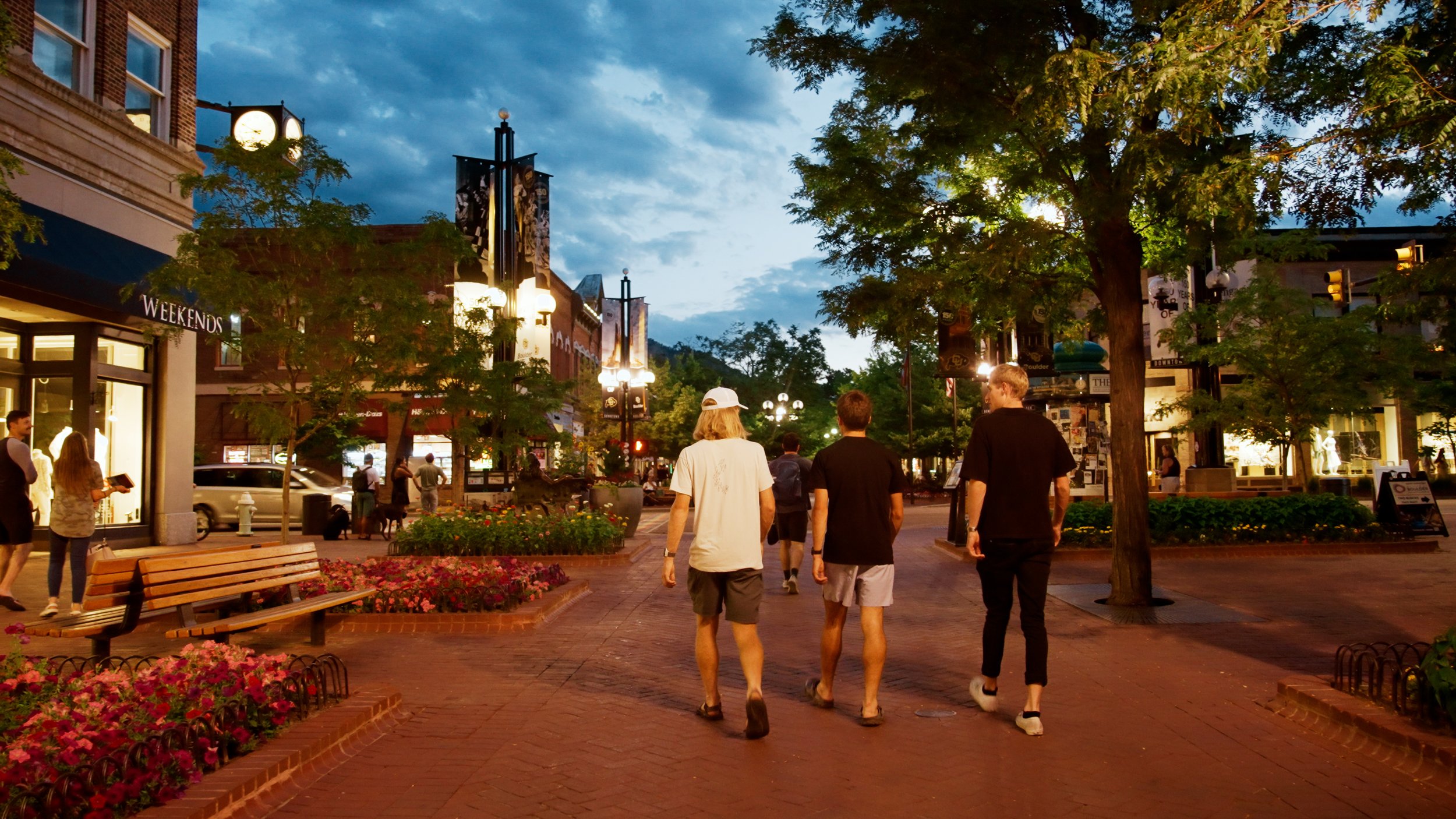 the trail house athletes walking around downtown Boulder Colorado on Pearl Street