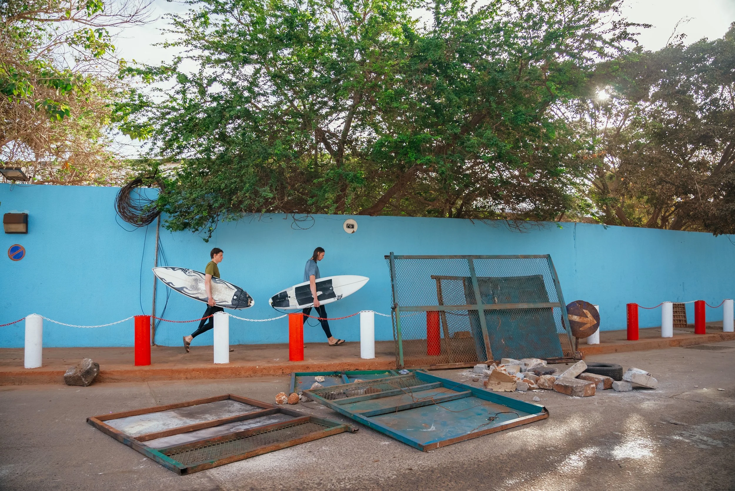 two men with surfboards