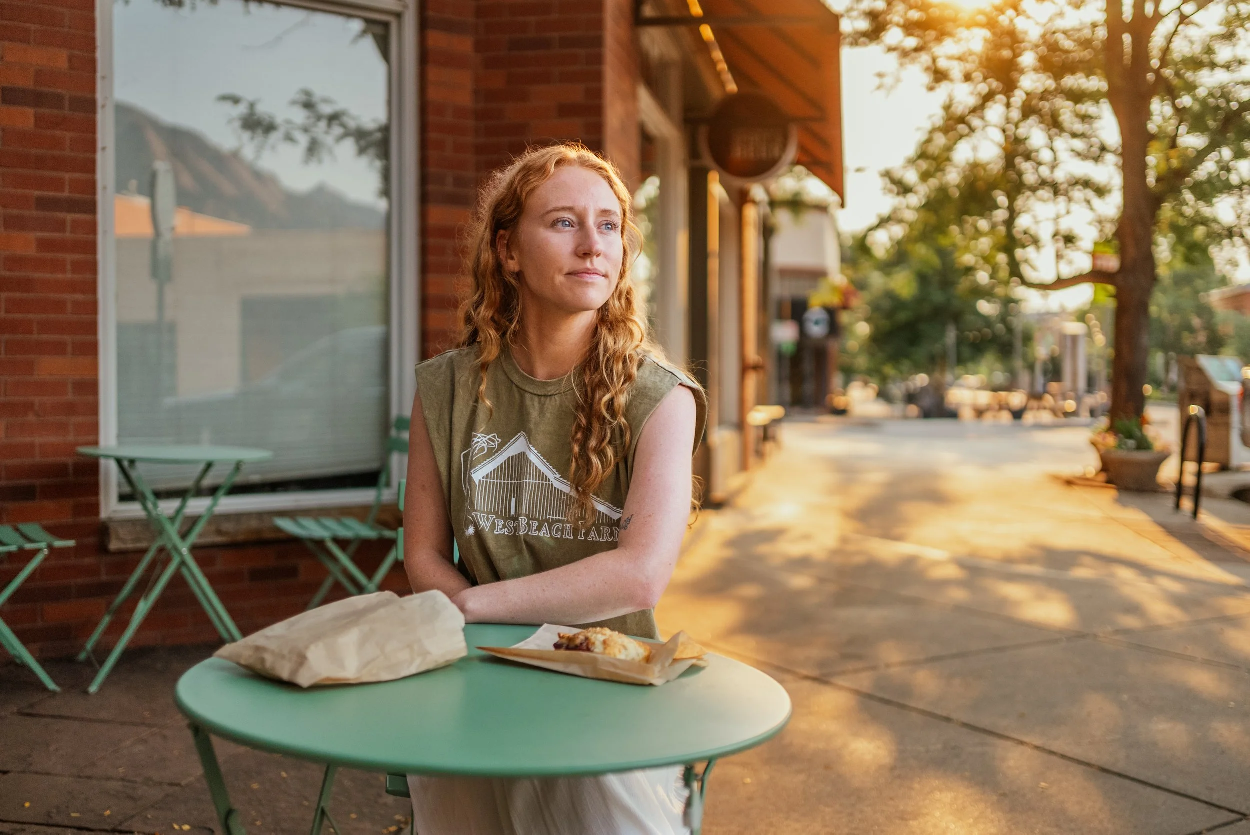 Mallory sitting at table in Boulder, Colorado