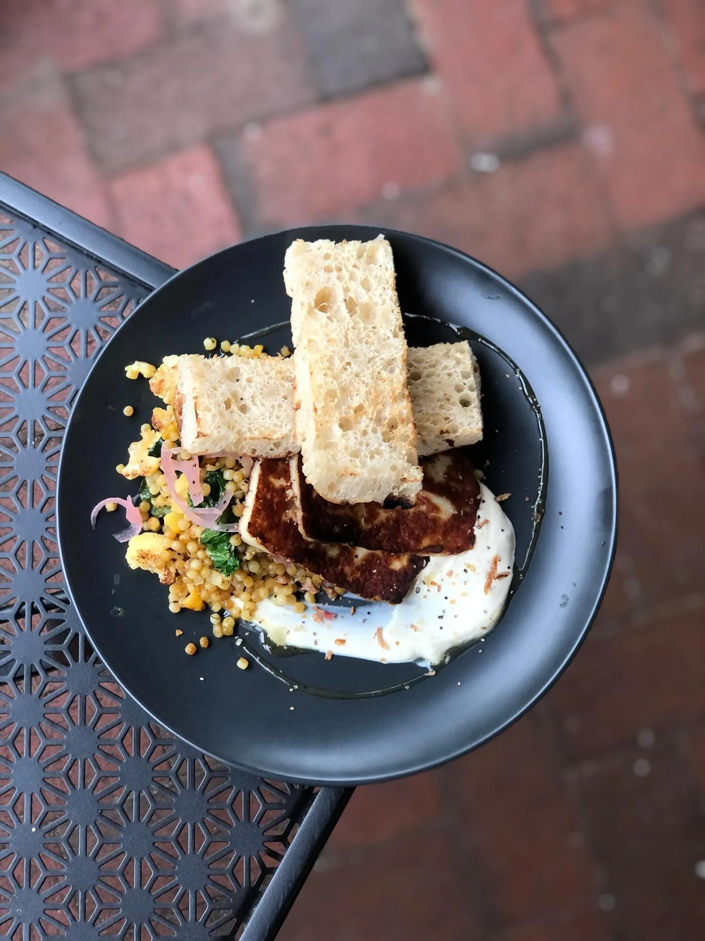 Serving brunch goodness ✨

🍽️ Middle Eastern Breakfast &bull; pearl cous-cous, preserved Aranda lemons, dried apricot, za&rsquo;atar roasted cauliflower, lightly pickled onion, halloumi, herb yoghurt &amp; pomegranate molasses with Clementine Focacc