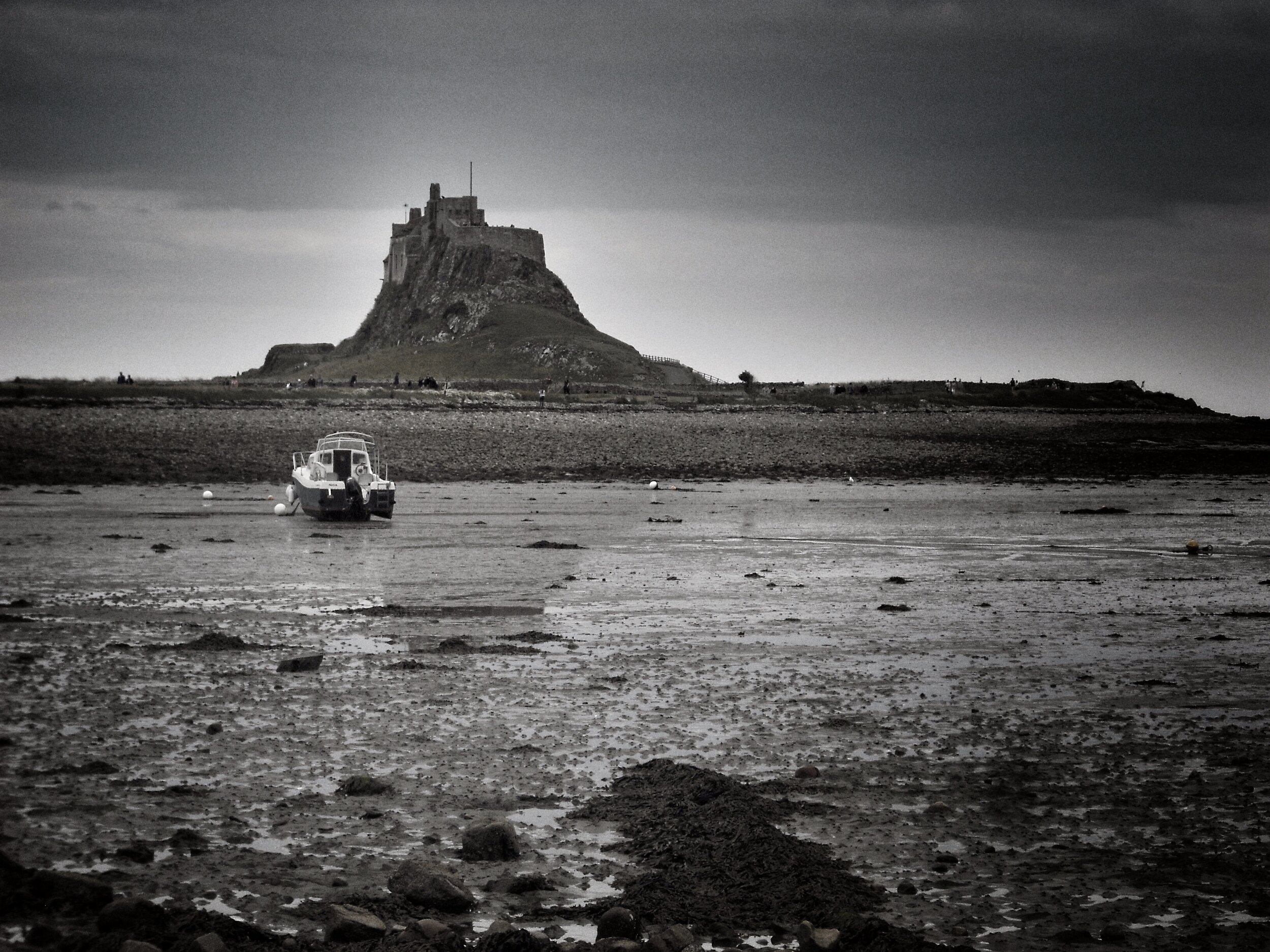 Artistic image in black and white of a castle and beach