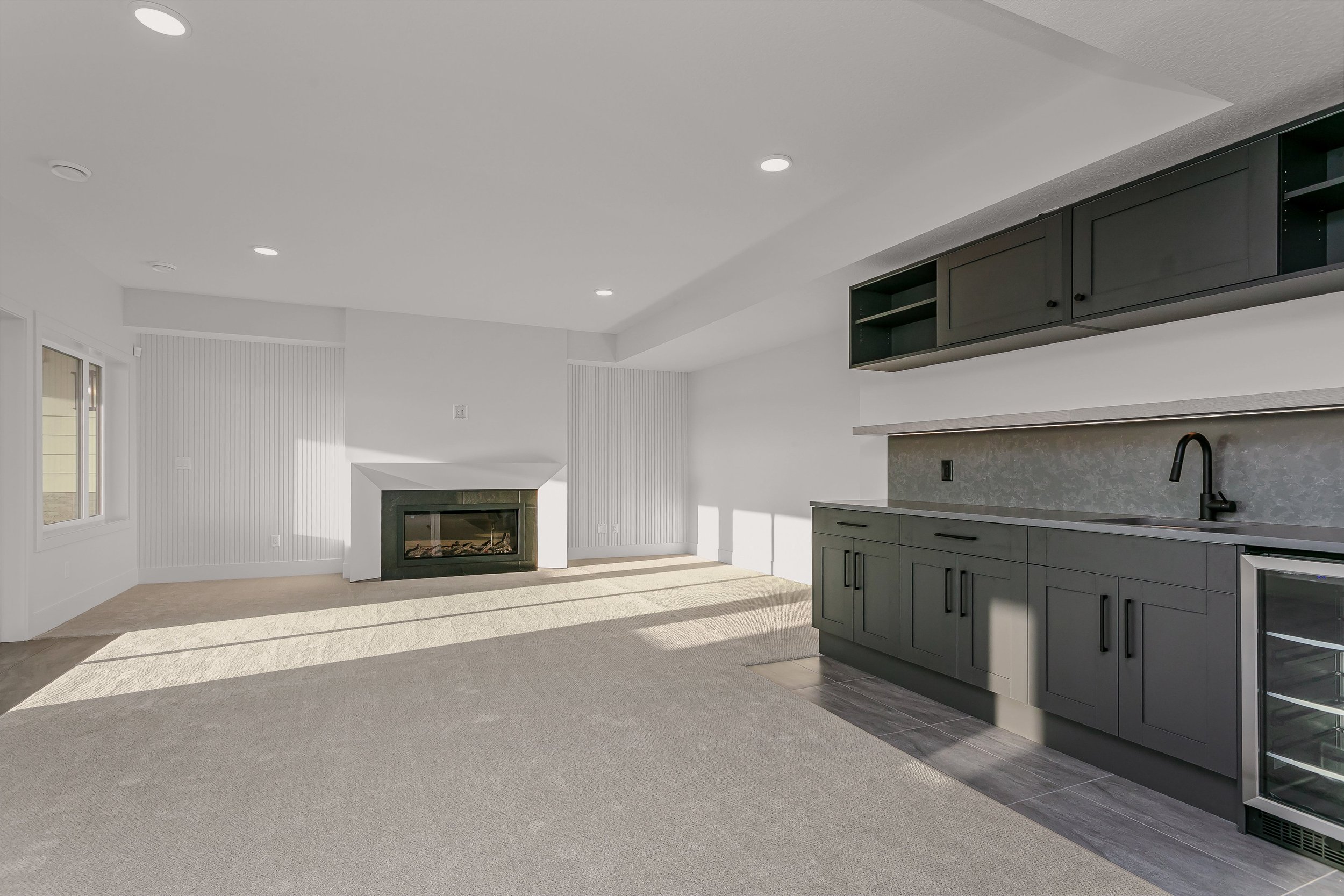 Basement with wet bar in the Lakefront at 24 Jubilation Drive in Jensen Lakes St. Albert by Urbis Infill Homes. (Copy)
