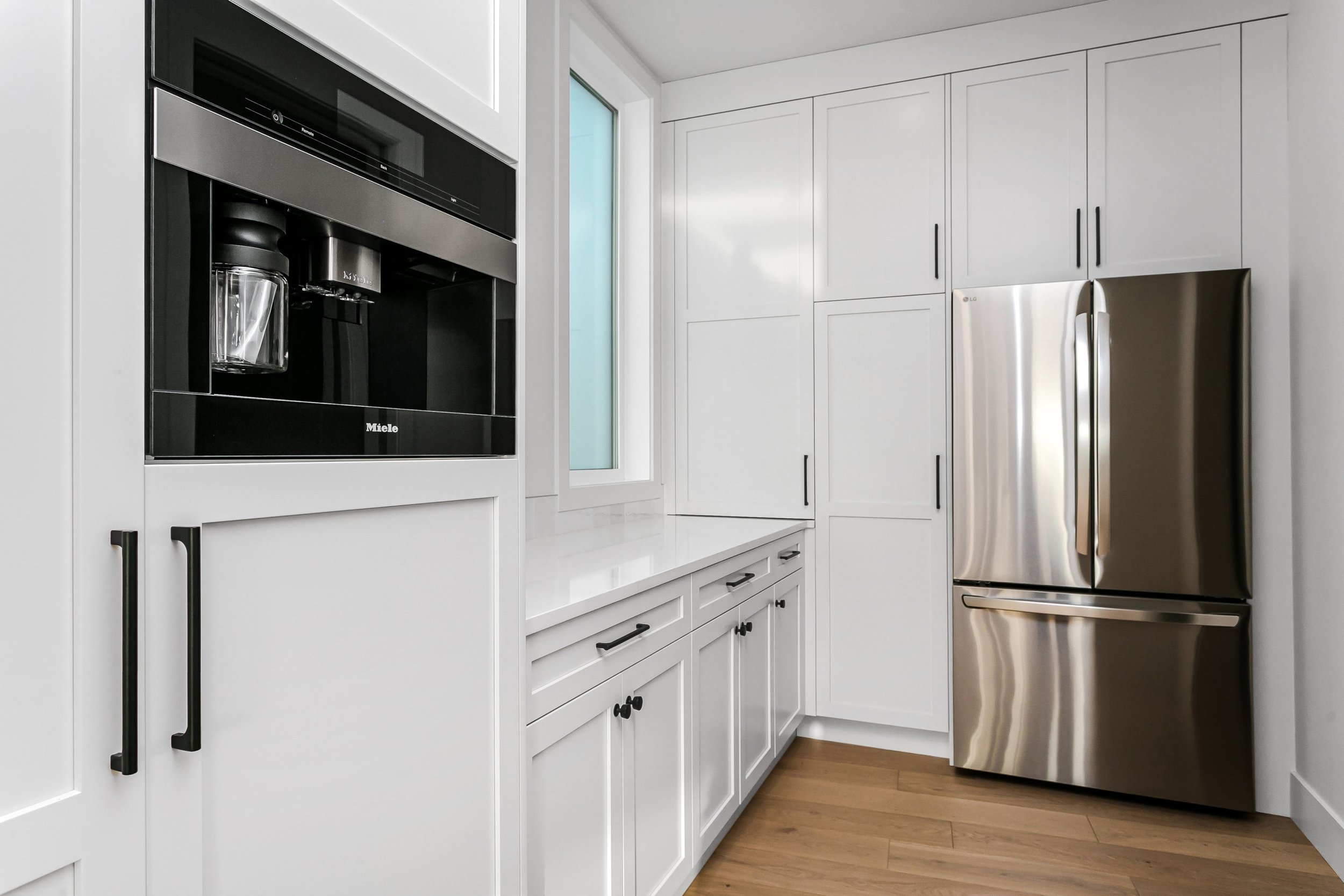 Butler's pantry in the Lakefront at 24 Jubilation Drive in Jensen Lakes St. Albert by Urbis Infill Homes. (Copy)