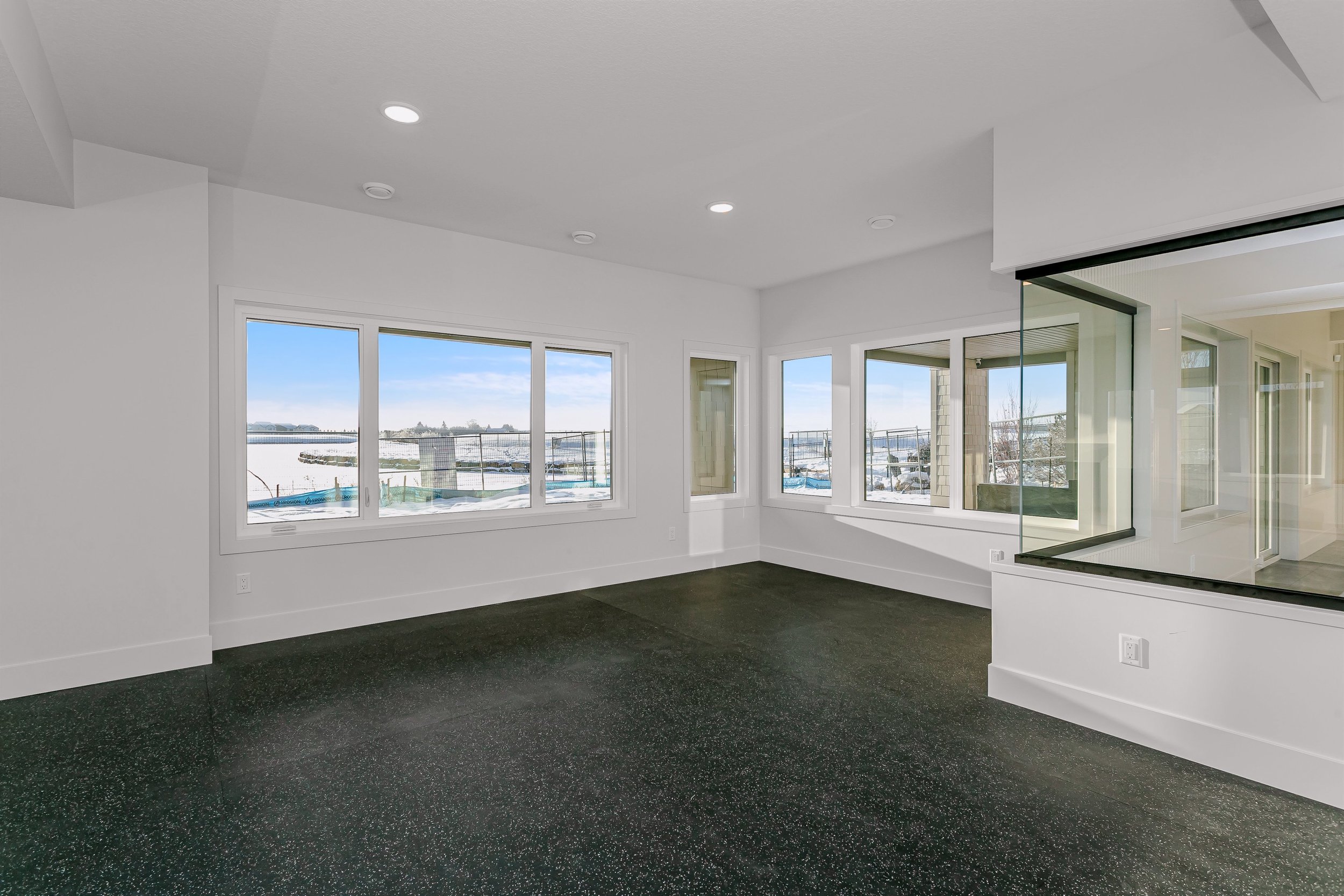 Home gym in the Lakefront at 24 Jubilation Drive in Jensen Lakes St. Albert by Urbis Infill Homes. (Copy)