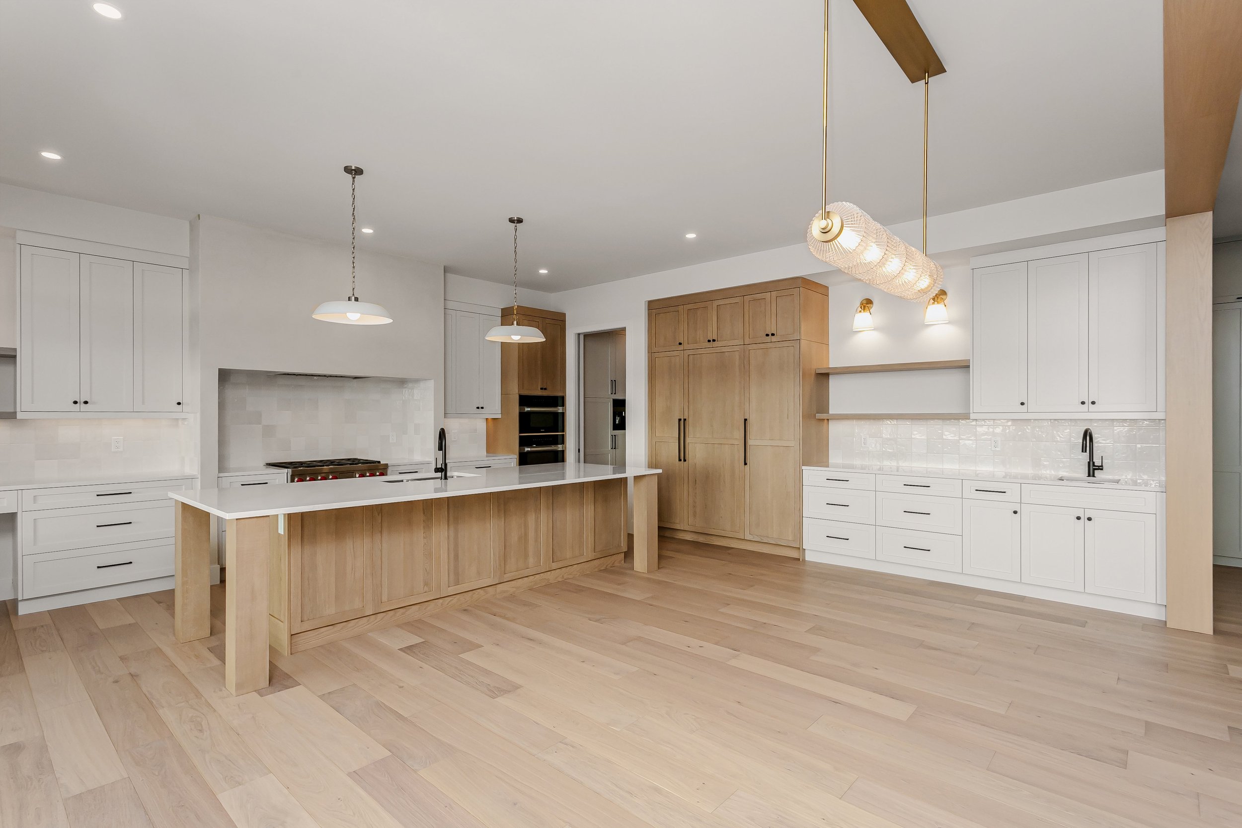 Kitchen and dining area in the Lakefront at 24 Jubilation Drive in Jensen Lakes St. Albert by Urbis Infill Homes. (Copy)