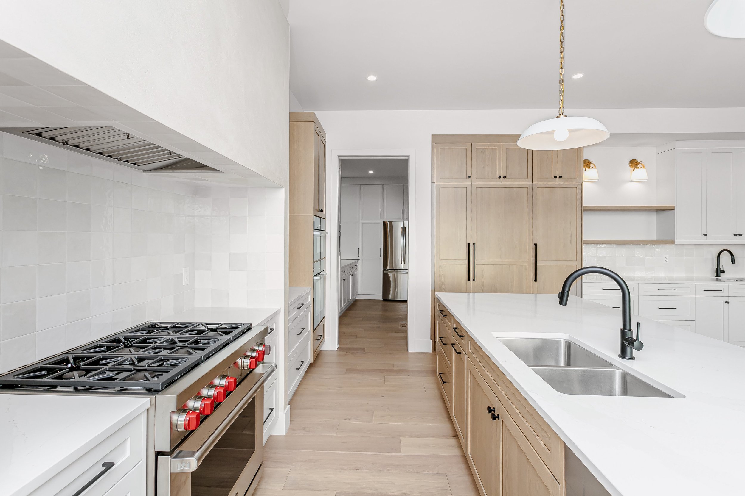Kitchen in the Lakefront at 24 Jubilation Drive in Jensen Lakes St. Albert by Urbis Infill Homes. (Copy)
