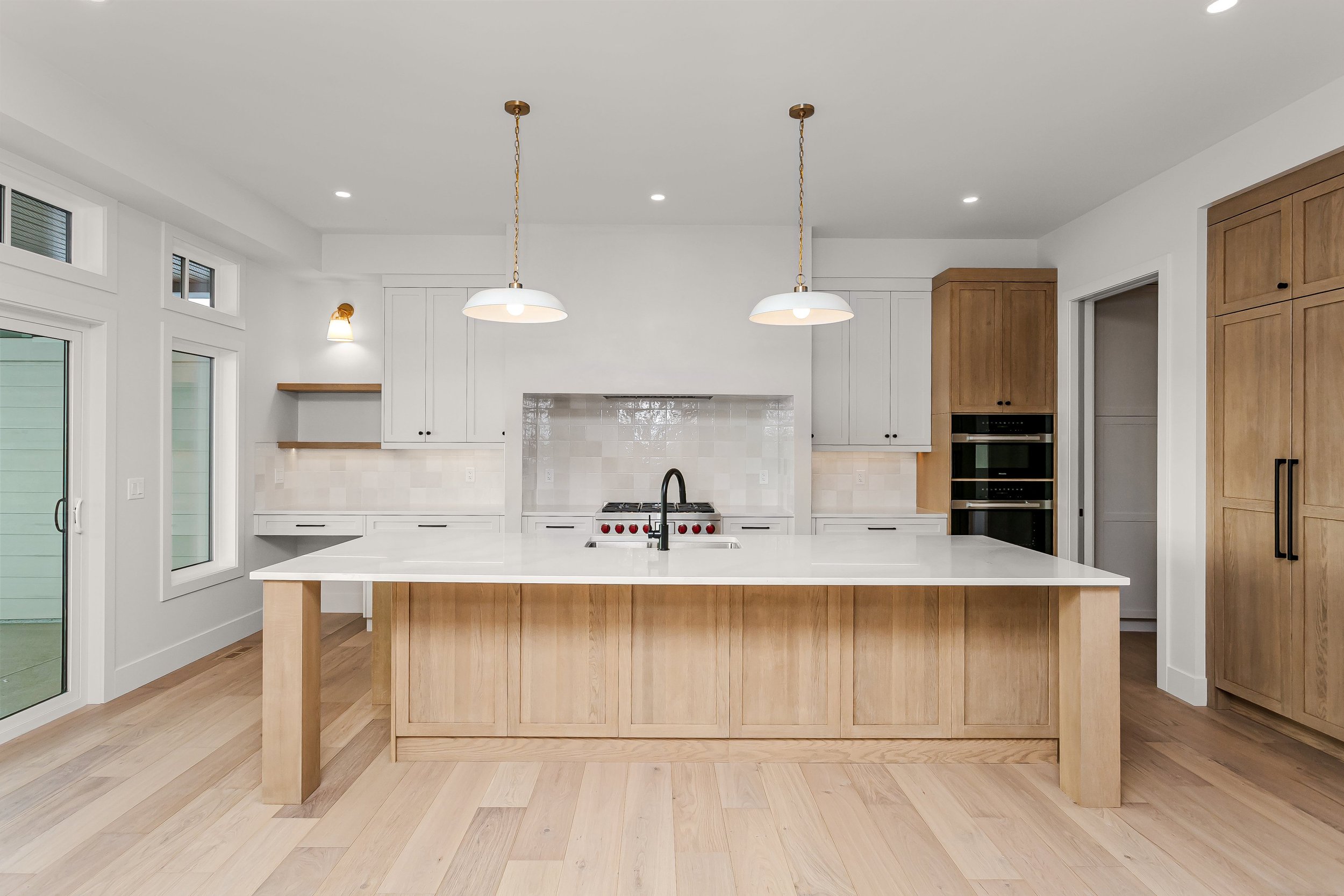 Kitchen in the Lakefront at 24 Jubilation Drive in Jensen Lakes St. Albert by Urbis Infill Homes. (Copy)