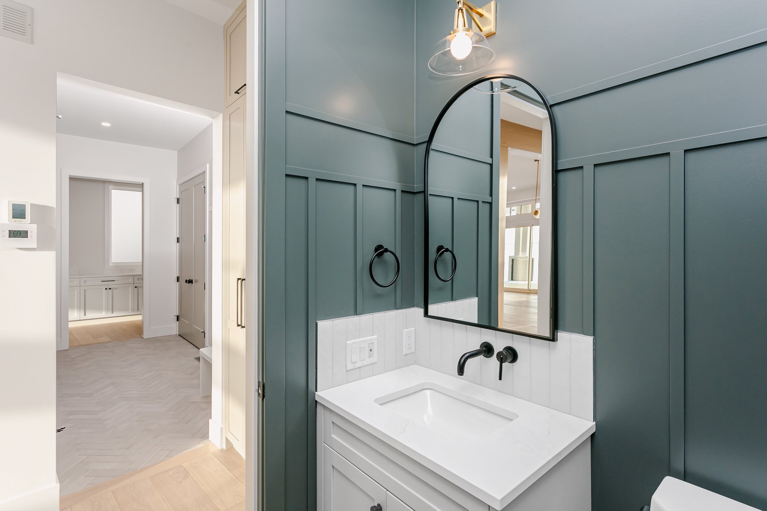 Powder room in the Lakefront at 24 Jubilation Drive in Jensen Lakes St. Albert by Urbis Infill Homes. (Copy)