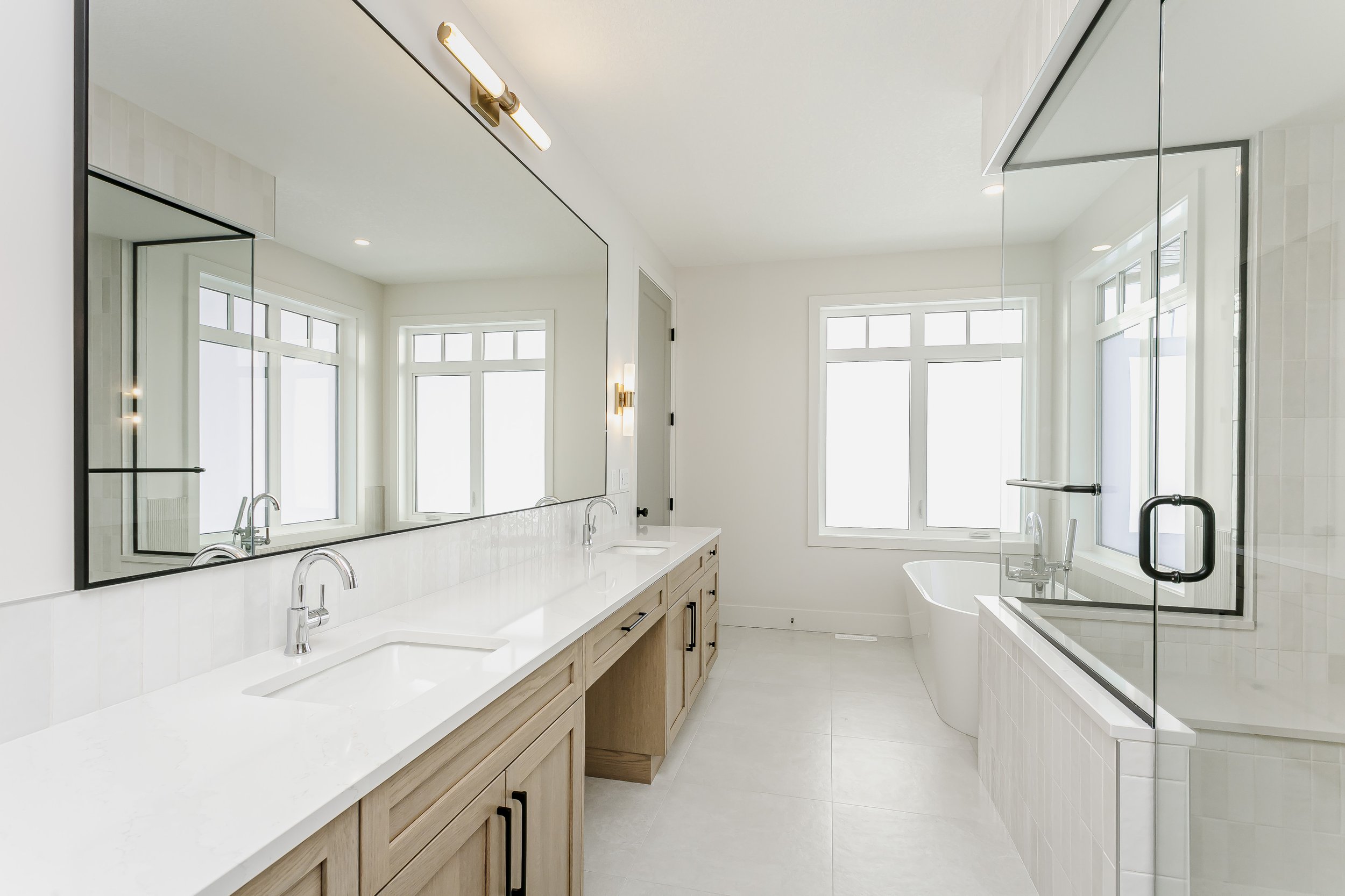 Primary bathroom in the Lakefront at 24 Jubilation Drive in Jensen Lakes St. Albert by Urbis Infill Homes. (Copy)