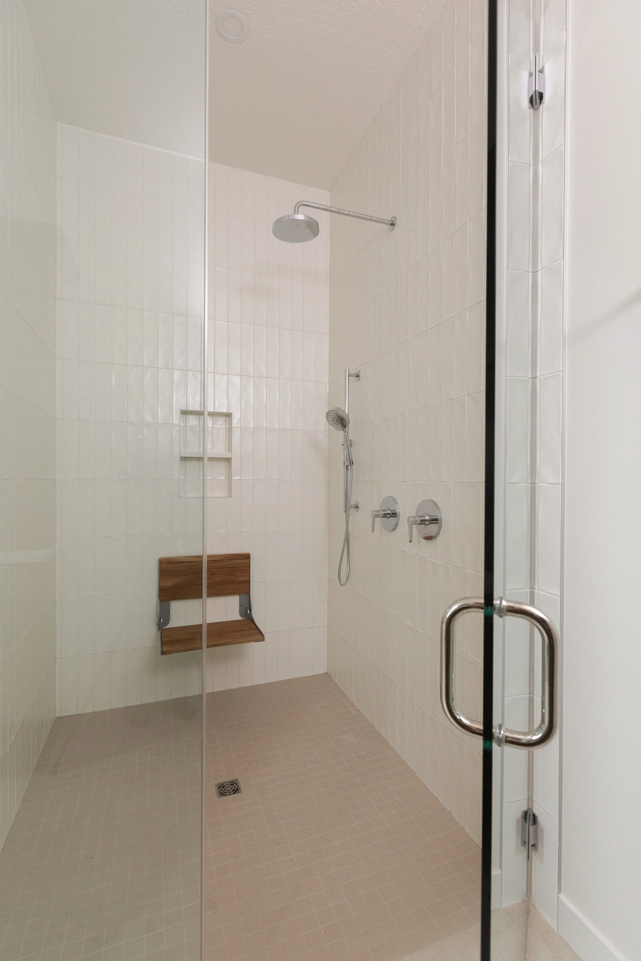 Accessible shower in Parkview 89 custom home by Urbis Infill Homes in Edmonton.