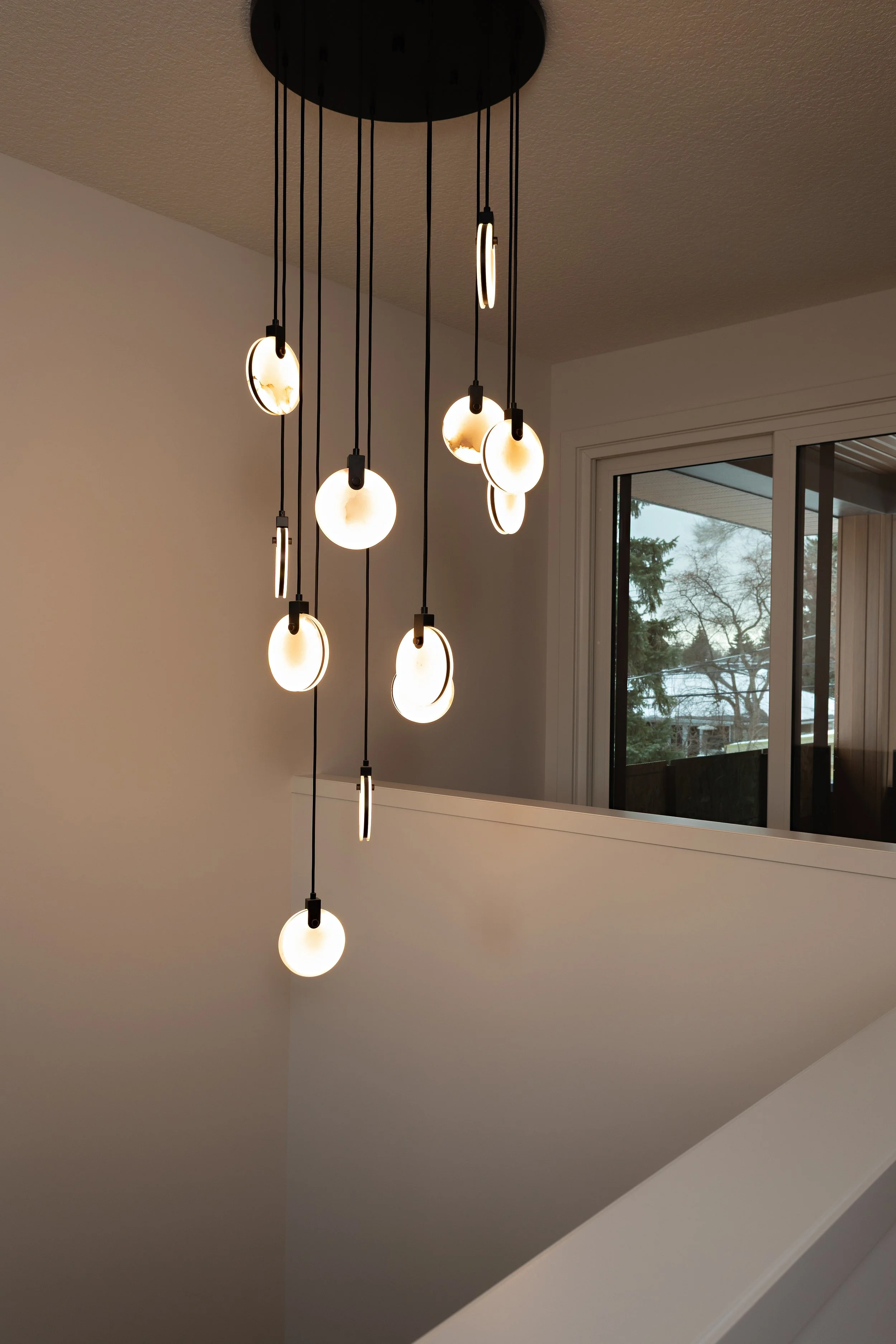 Light fixture in Parkview 89 custom home by Urbis Infill Homes in Edmonton.