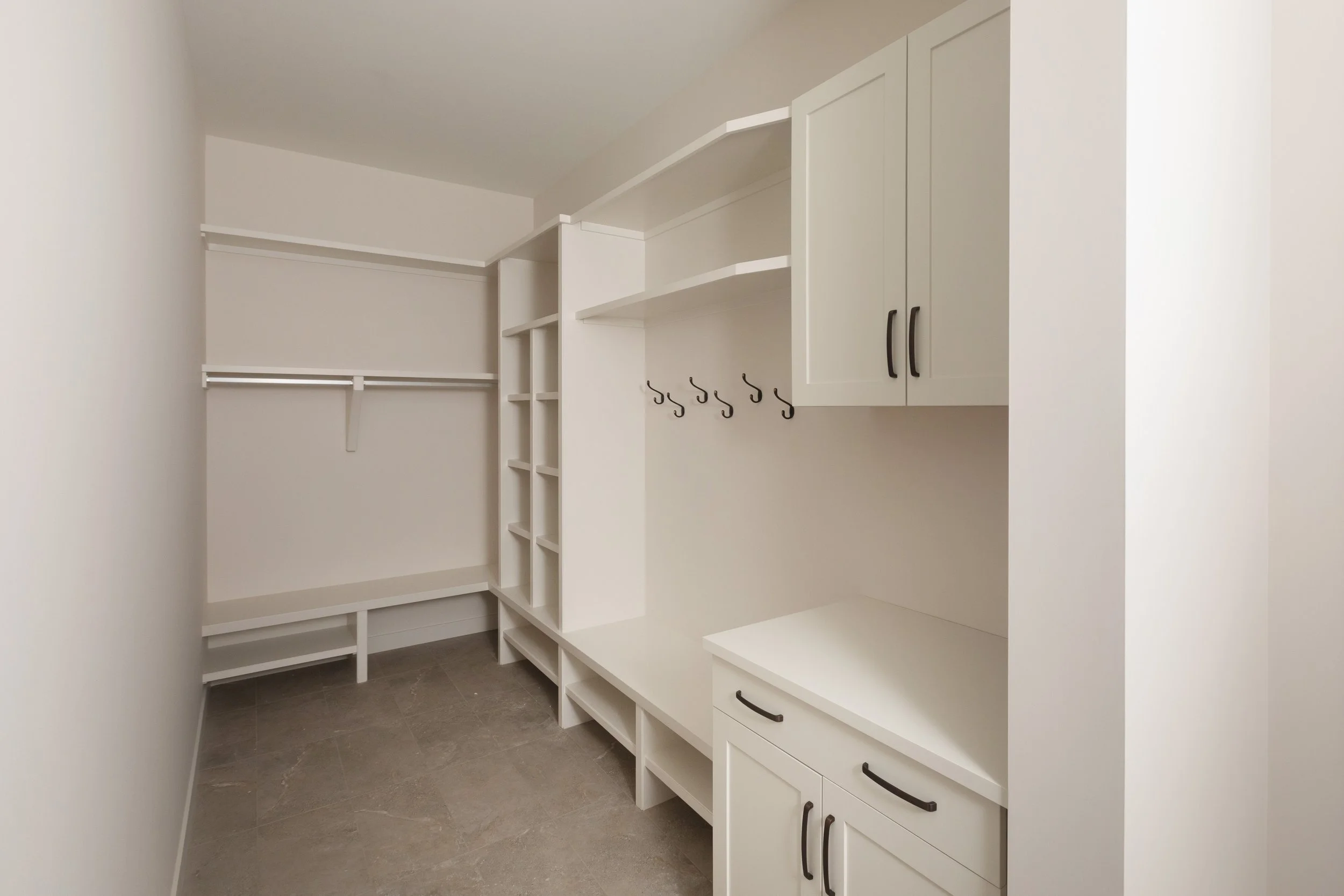 Mudroom in Parkview 89 custom home by Urbis Infill Homes in Edmonton.