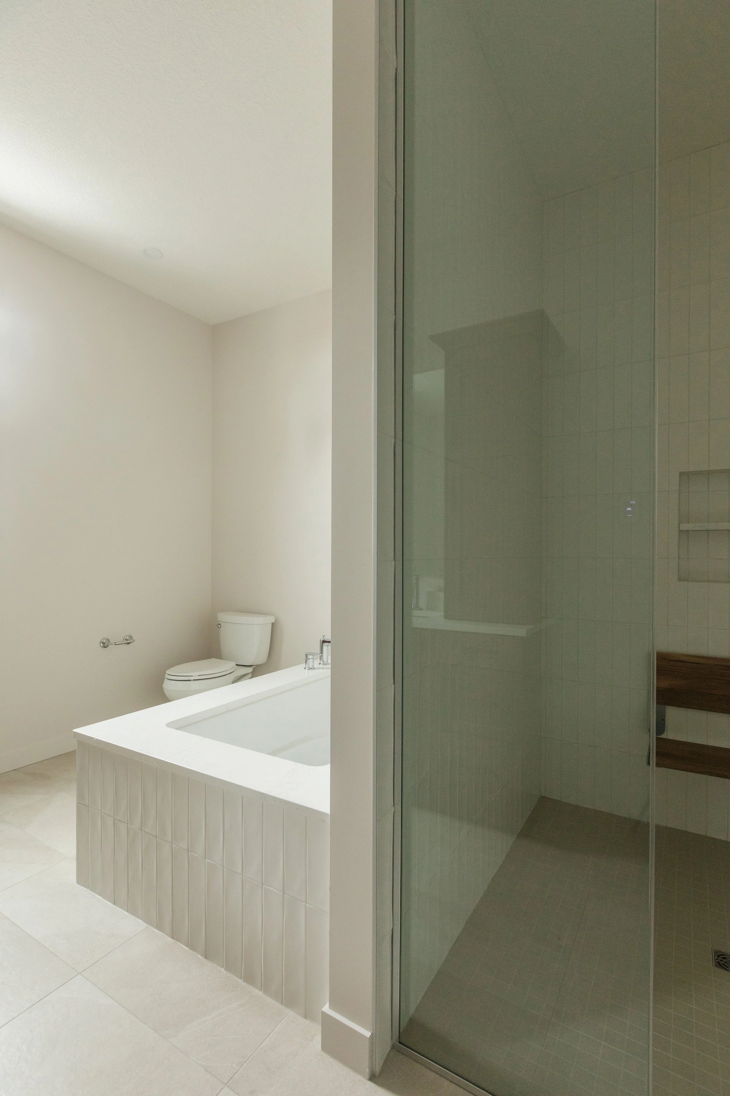 Accessible bathroom in Parkview 89 custom home by Urbis Infill Homes in Edmonton.