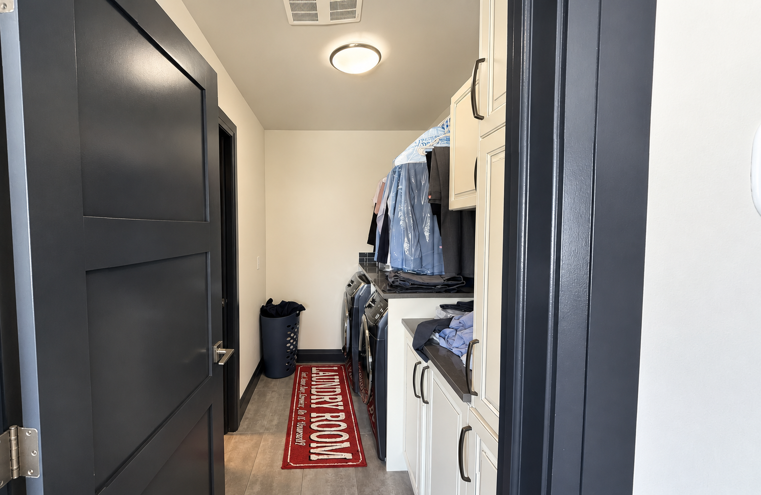 Laundry room in the Sherwood Park Reno by Urbis Infill Homes.