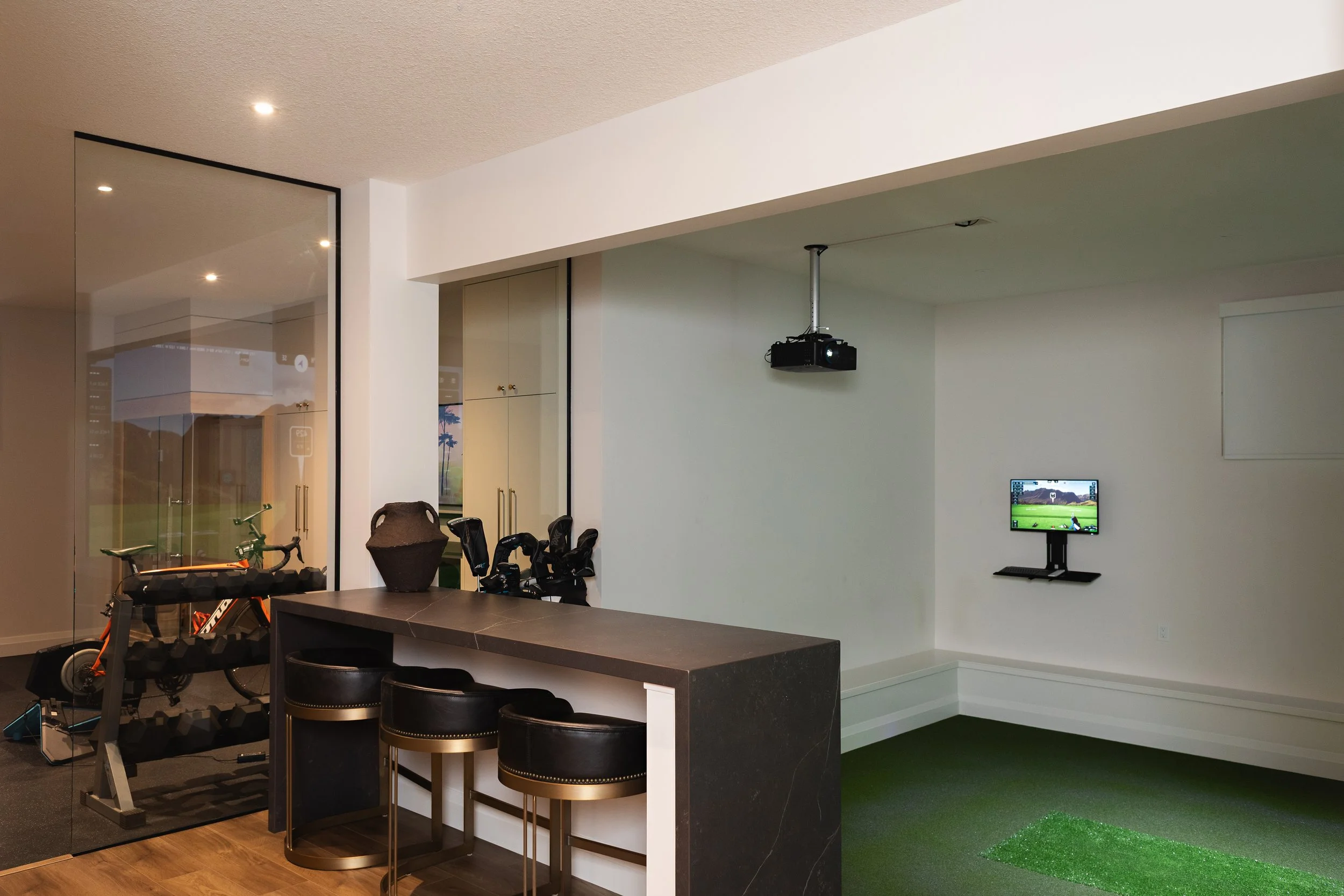 Golf sim in the Sherwood Park Reno by Urbis Infill Homes.
