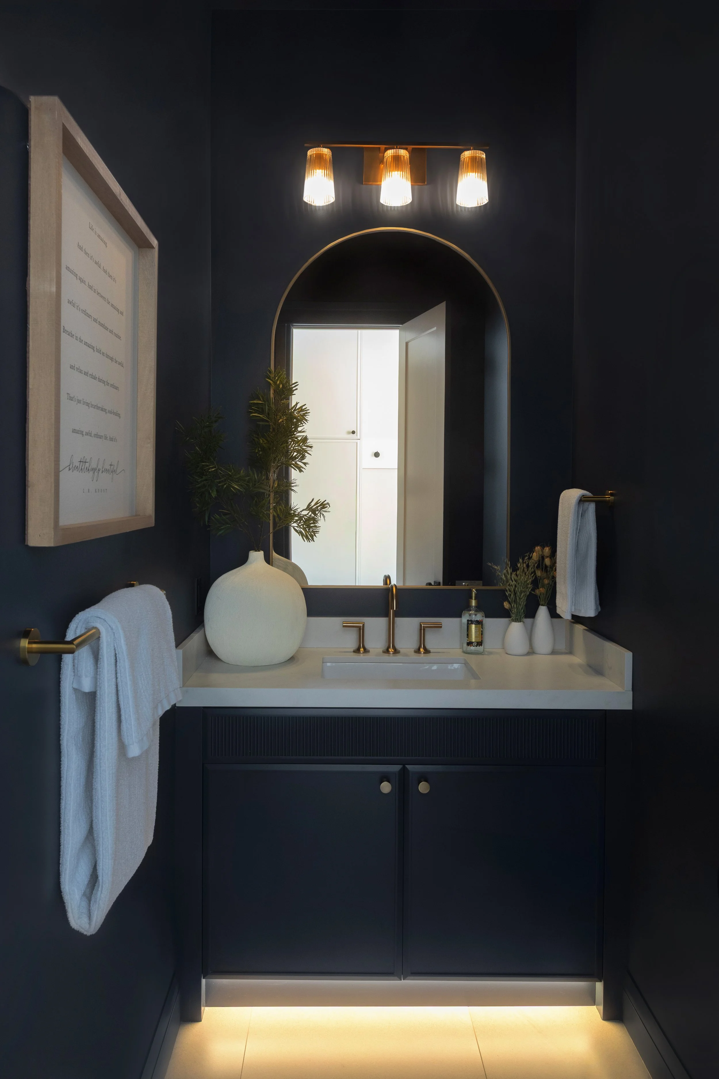 Powder room in the Sherwood Park Reno by Urbis Infill Homes.