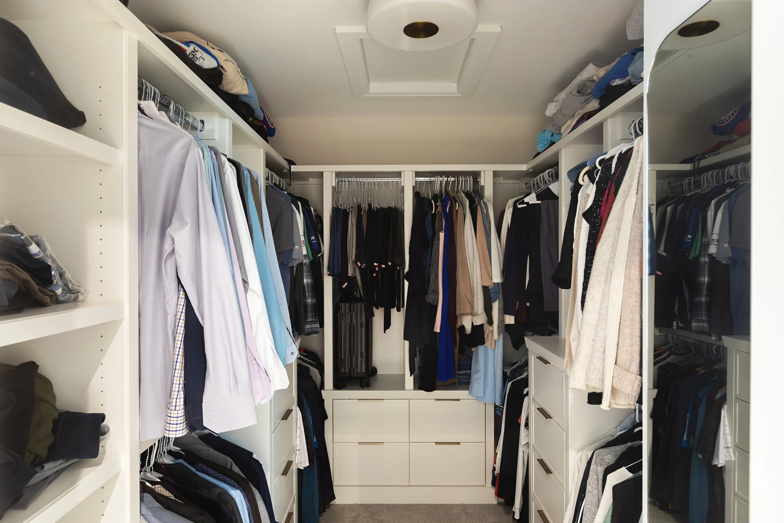 Walk-in closet in the Sherwood Park Reno by Urbis Infill Homes.