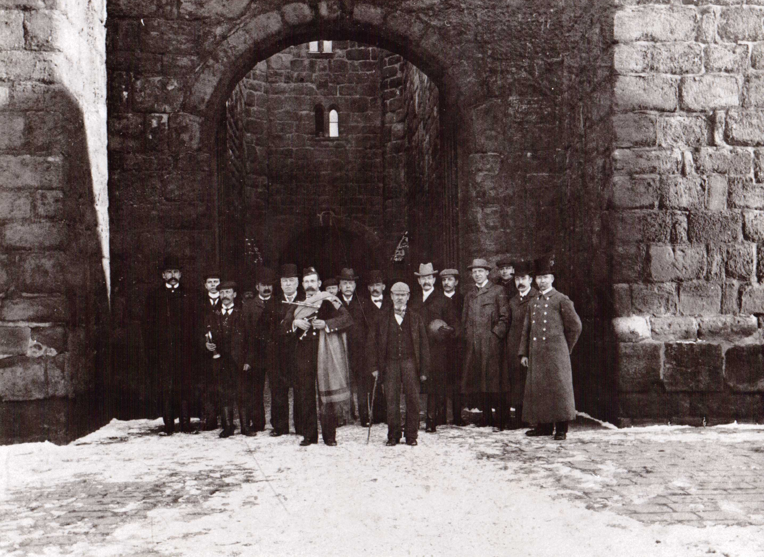 James Hall Dukes' Piper - outside the Barbican, Alnwick Castle, Shrove Tuesday (year unknown). Photograph by kind permission of the Bailifgate Museum, Alnwick
