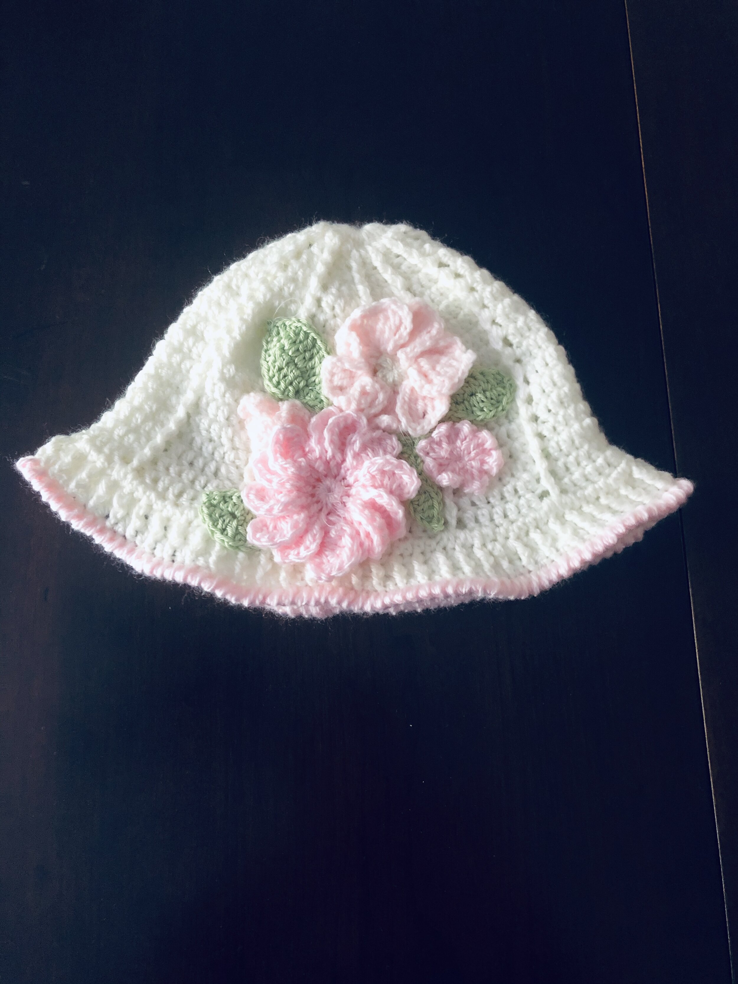 Item #C1068 - Crochet White Hat with Pink Trim and Raised Flowers