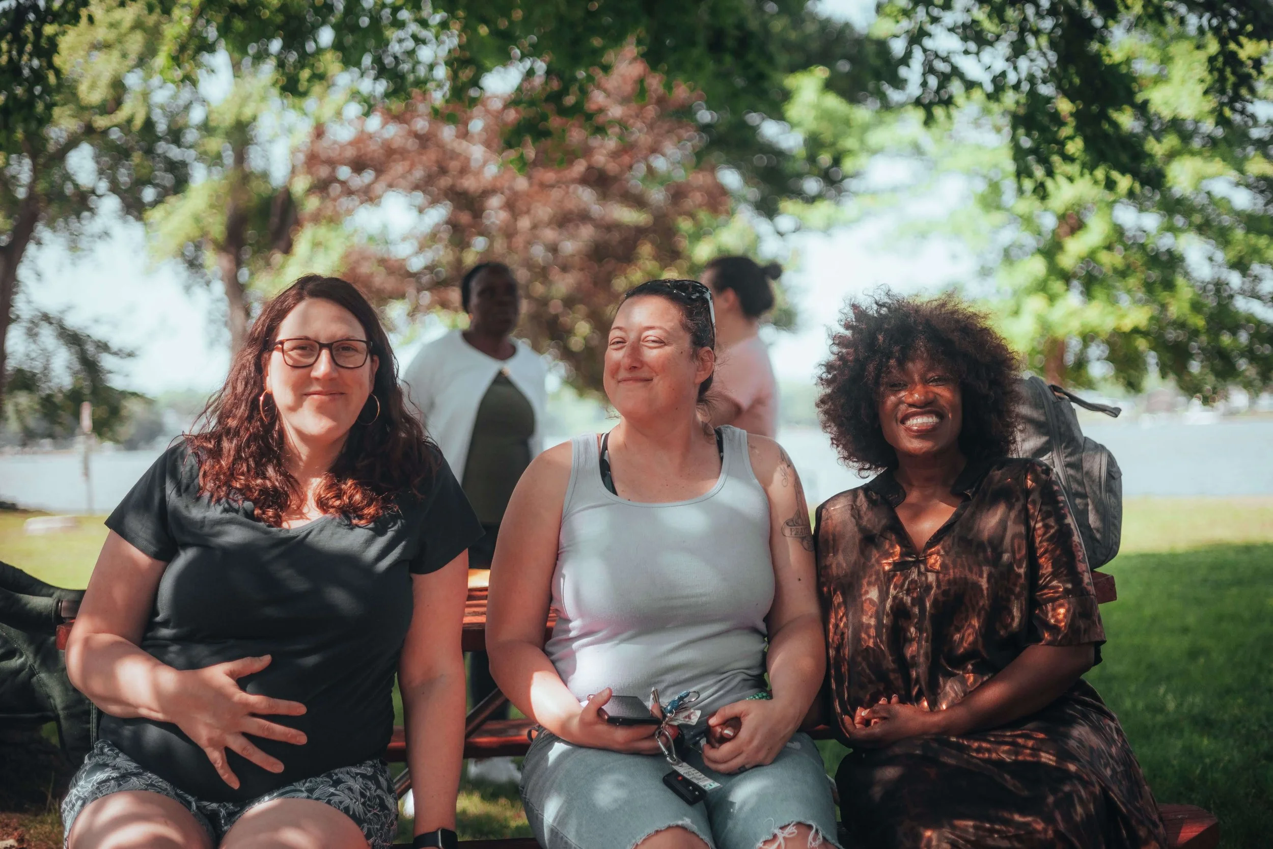 three women smiling at camera