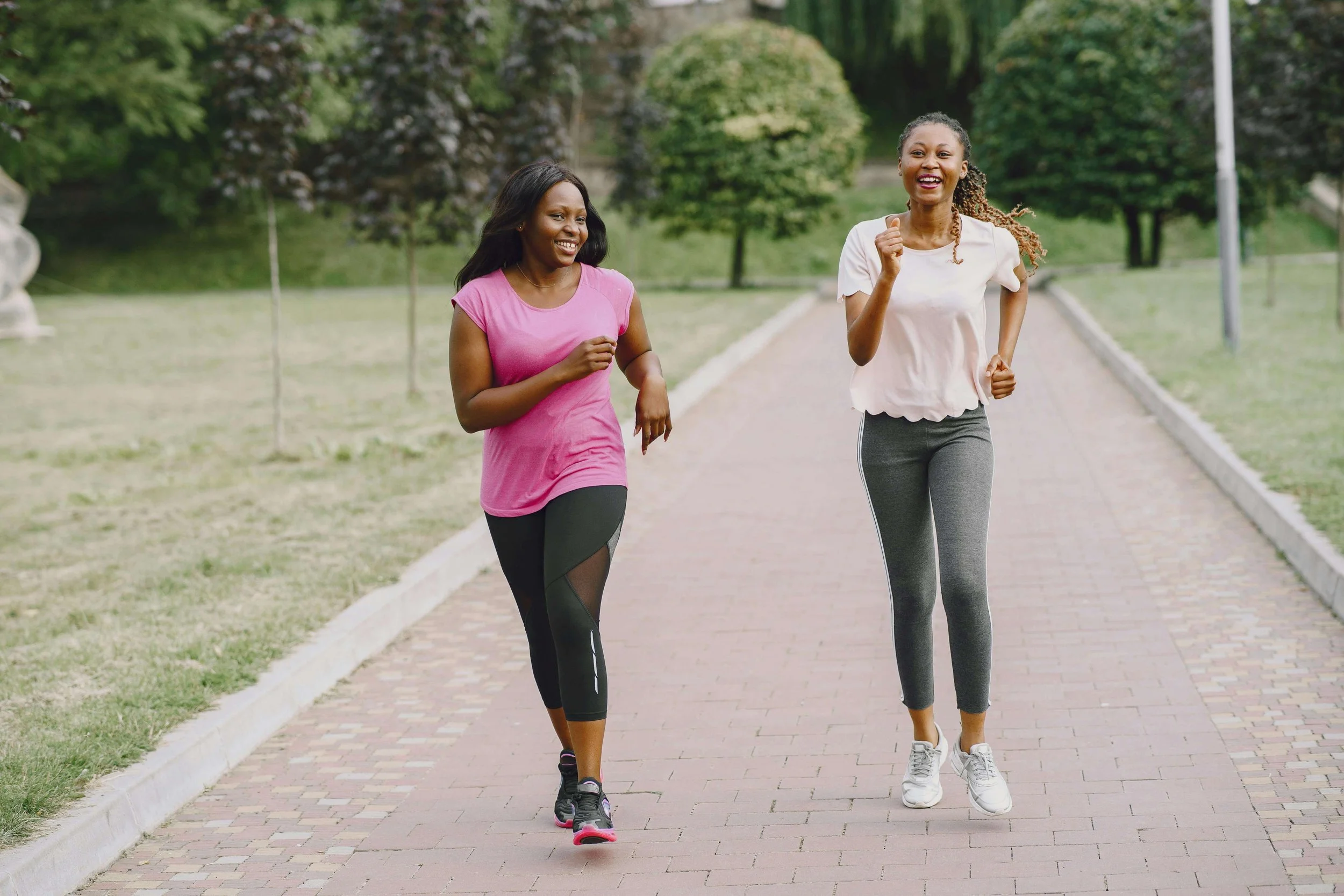 Two women running outside