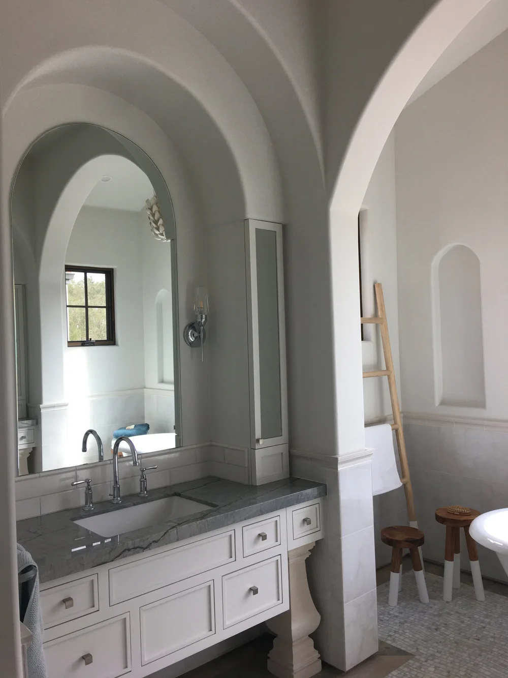  Lovely archways create a multi-layered look in the primary bathroom and a peaceful place to relax and take in the mountain views during a soak.&nbsp; 
