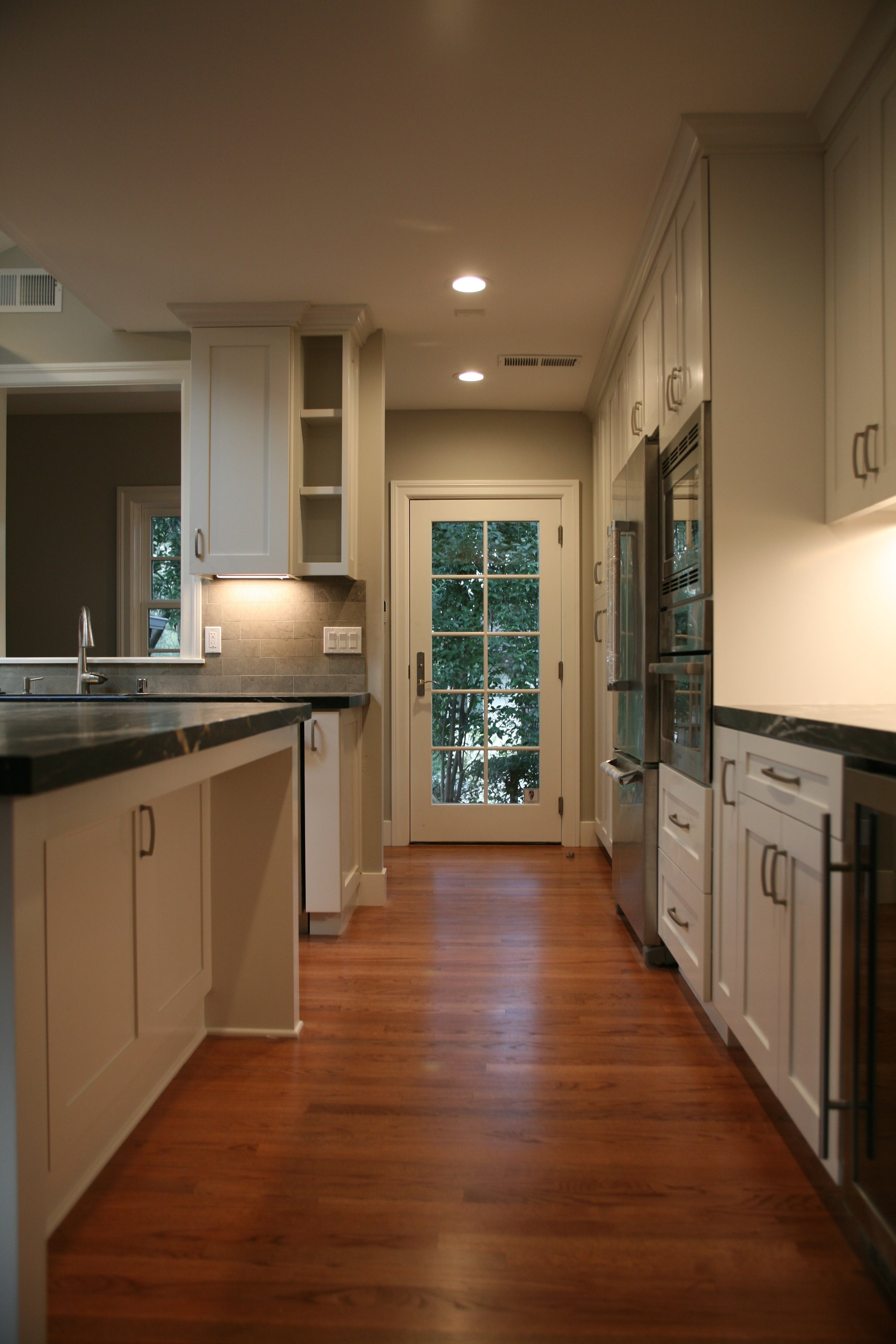 We reconfigured the space in the kitchen to create easy passageways like this one from the front of the house all the way to the back deck.
