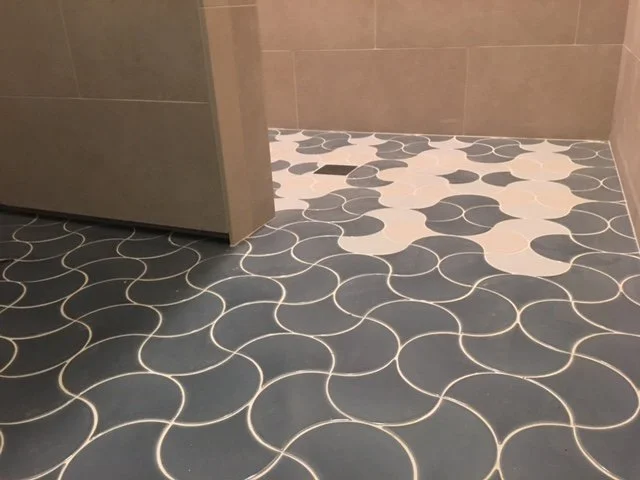  The floor plane can be interesting too, with the design of these recycled clay tiles. Select tiles provide color and pattern along with slip-resistance in a shower. 