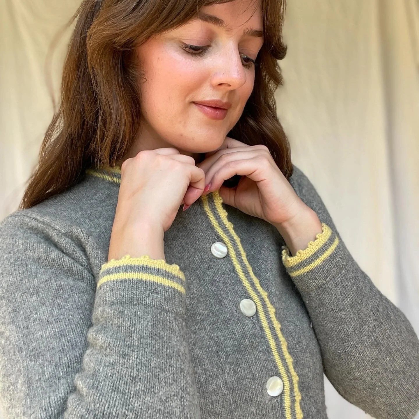 SOLD / Diane Rich grey wool cardigan with yellow detailing and pearlescent buttons. Lamb/Angora blend of wool. Fits between an XS-Small.

#amaranthusavailable