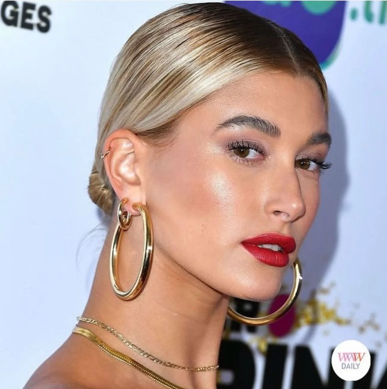 Hailey Bieber making a statement in her big and bold gold hoop earrings.