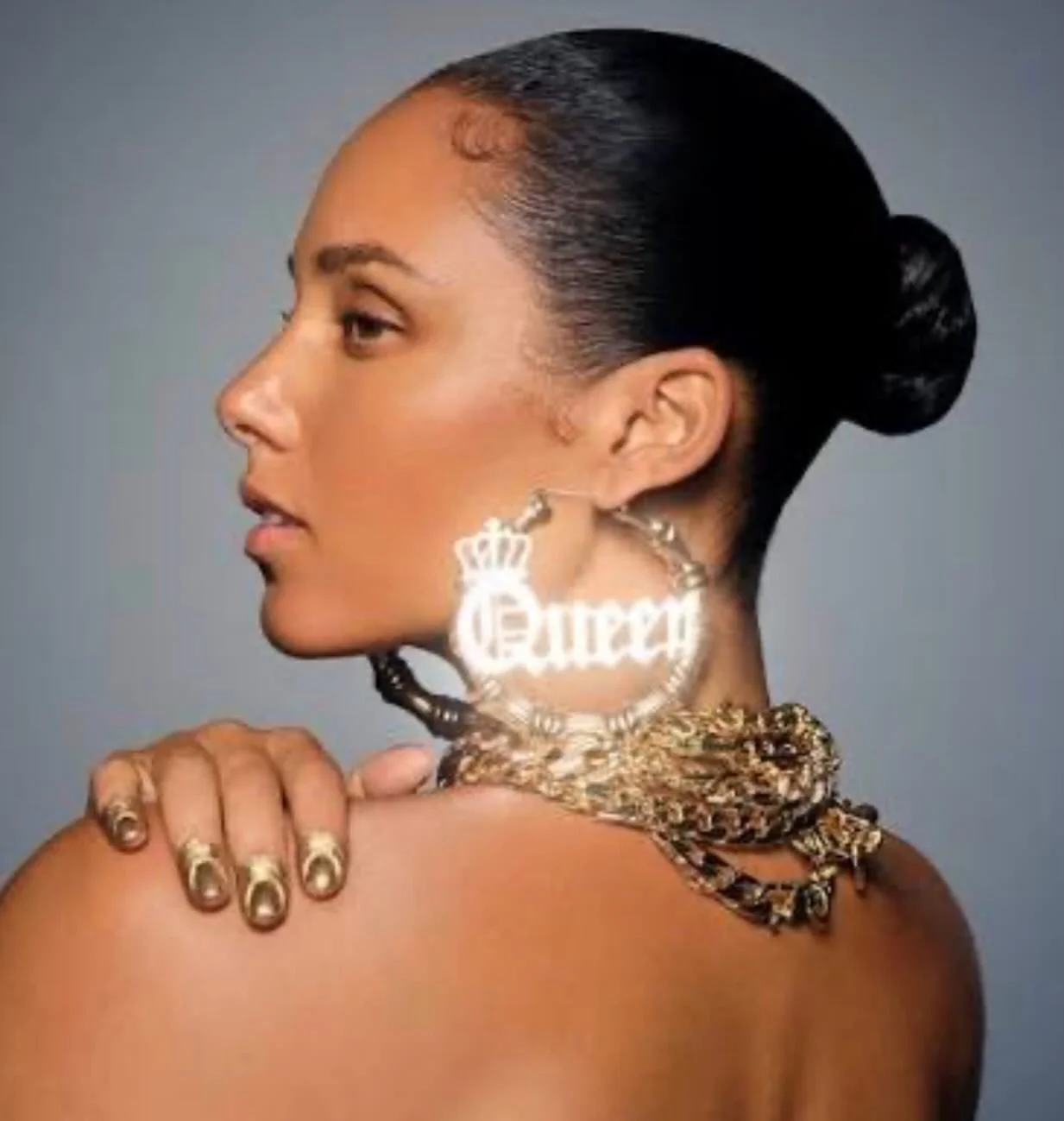 Gold girl, Alicia Keys in Queen Mode wrapped in bold gold links, rocking her nostalgic hoops.