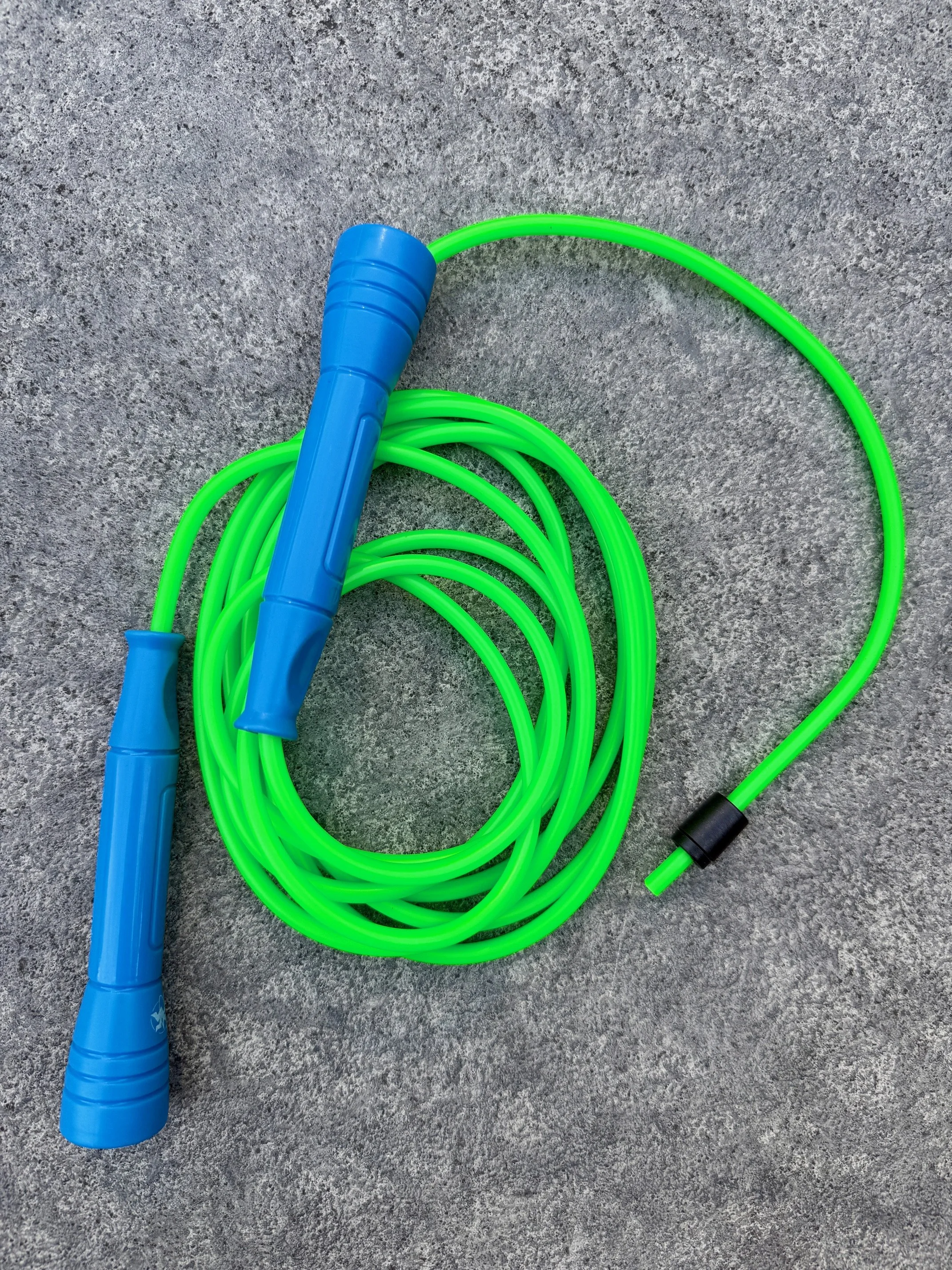 5mm PVC Earth jump rope (bright green cord with blue handles) in 5 sizes for jumpers up to 6 feet 4 inches.