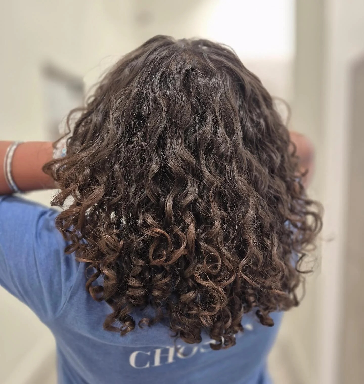 Defined, hydrated curls that hold their shape from roots to ends. At Blush, we have specialists in curl-by-curl shaping and custom hydration treatments for healthy, frizz-free definition! @mrsantaneishajones  nailed this perfect cut &amp; style.