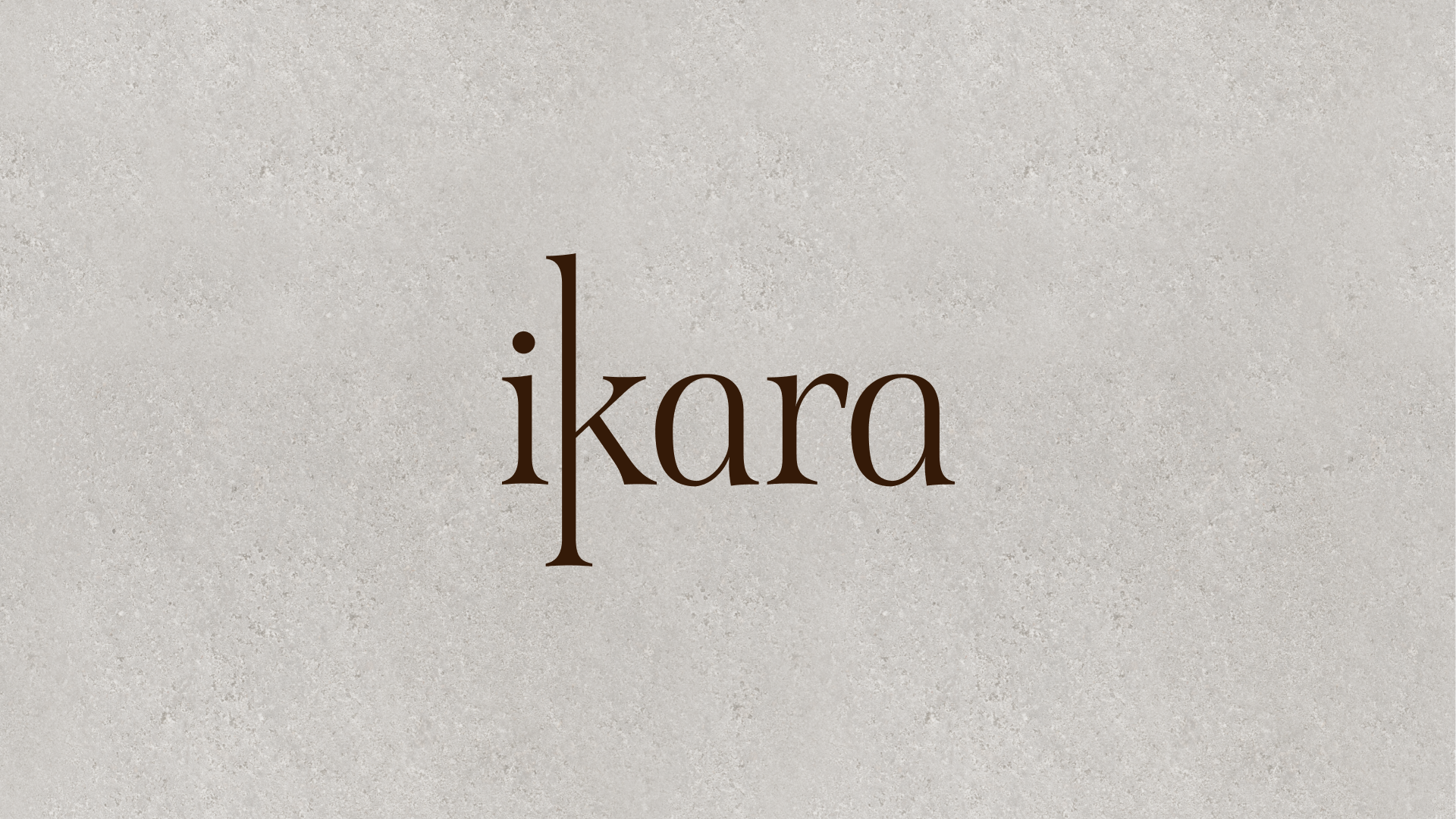 The logo of Ikara, with the brand name written in lowercase letters in a stylized serif font, on a neutral textured background.