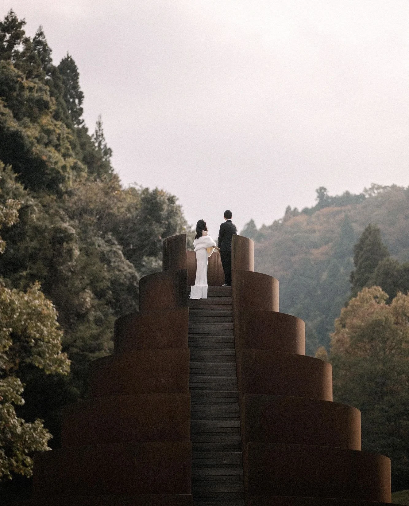 An art forest in the mountains of Japan. Sculptures between the trees. Installations that shift with the light and the weather and the season. The kind of place that doesn't ever really sit still, even when you're standing in it.⁠
⁠
These two didn't 