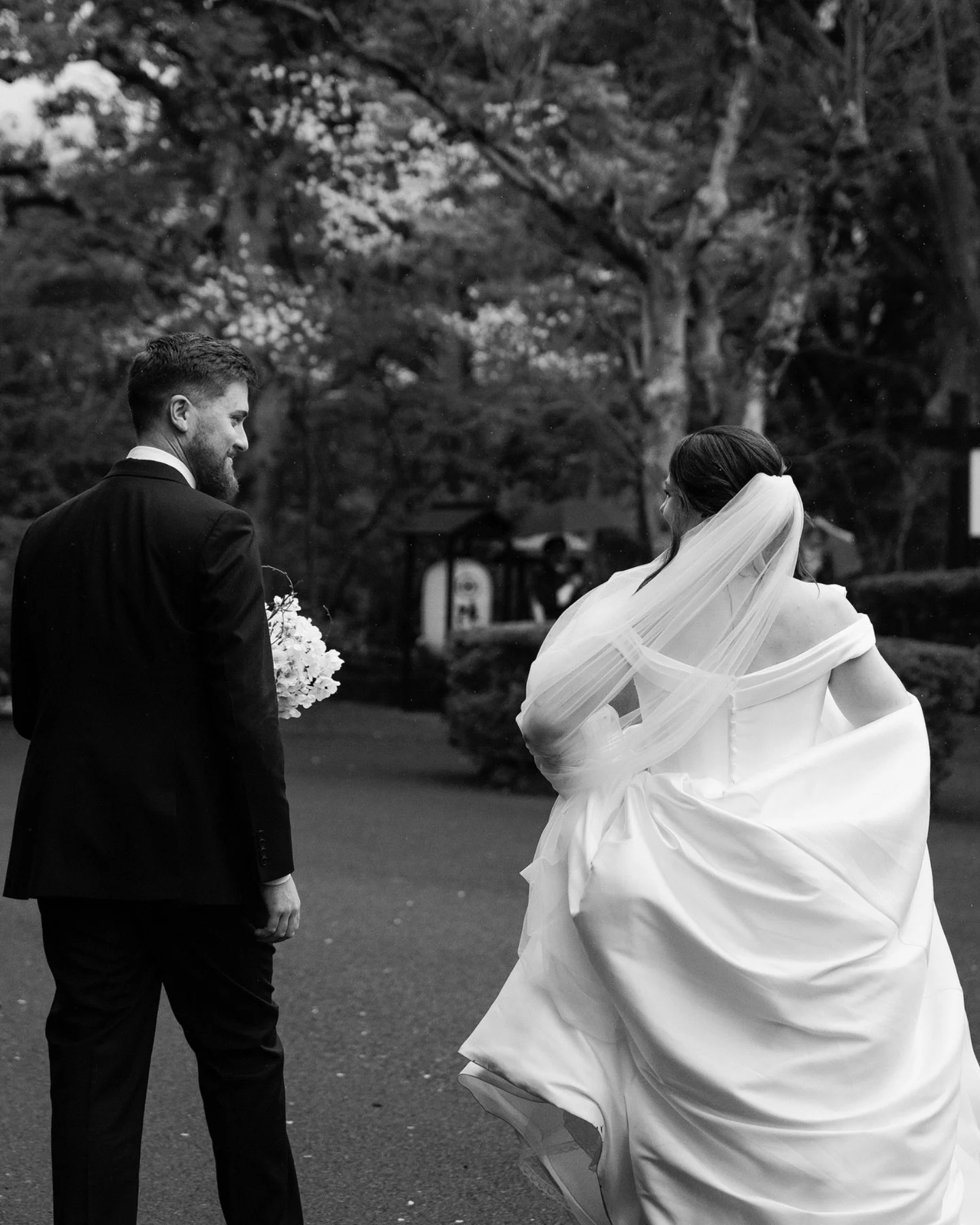 When a couple choose spring for their wedding, they&rsquo;re not only choosing the blossoms. They&rsquo;re choosing everything that comes with the blossoms. Rain included. The specific kind of grey that Japan does in early spring, where the air smell