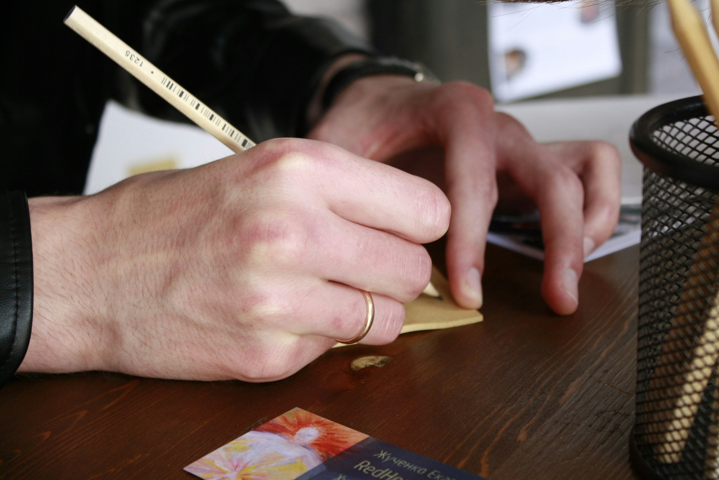 person writing note - light into you