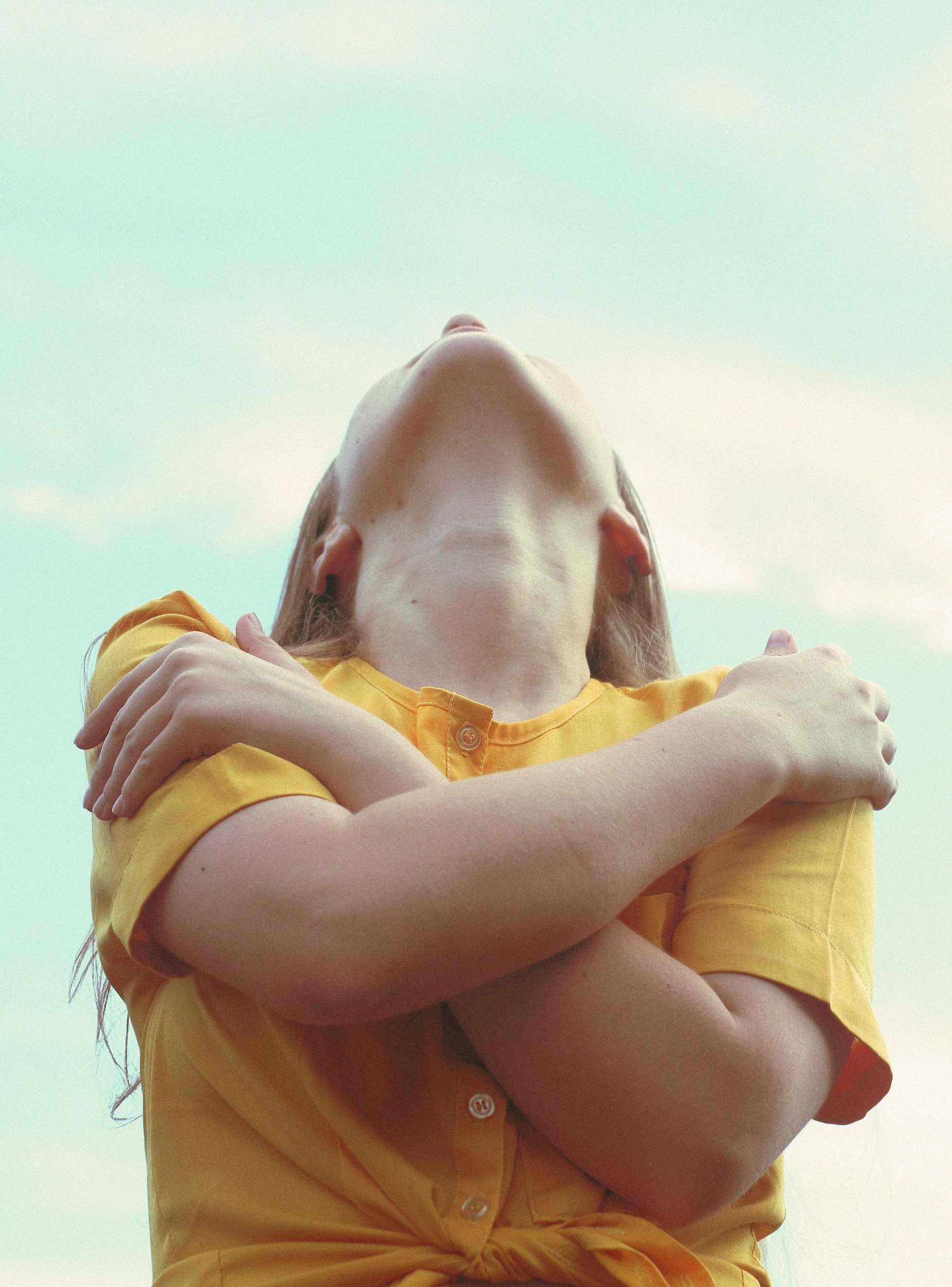 woman hugging herself - light into you
